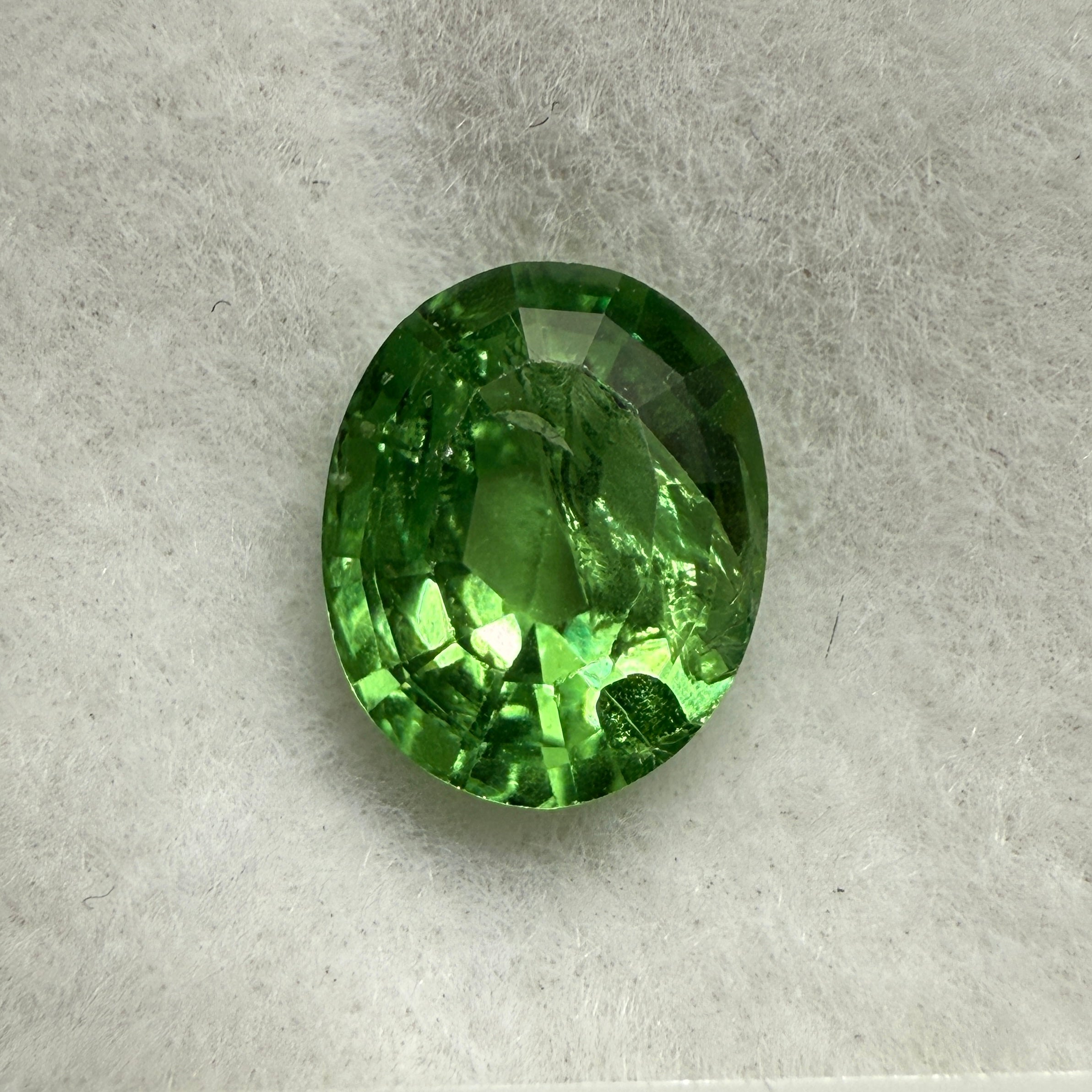 Tsavorite Garnet, 0.90ct, Kenya, Unheated Untreated, slight chip on crown facet, native cut.