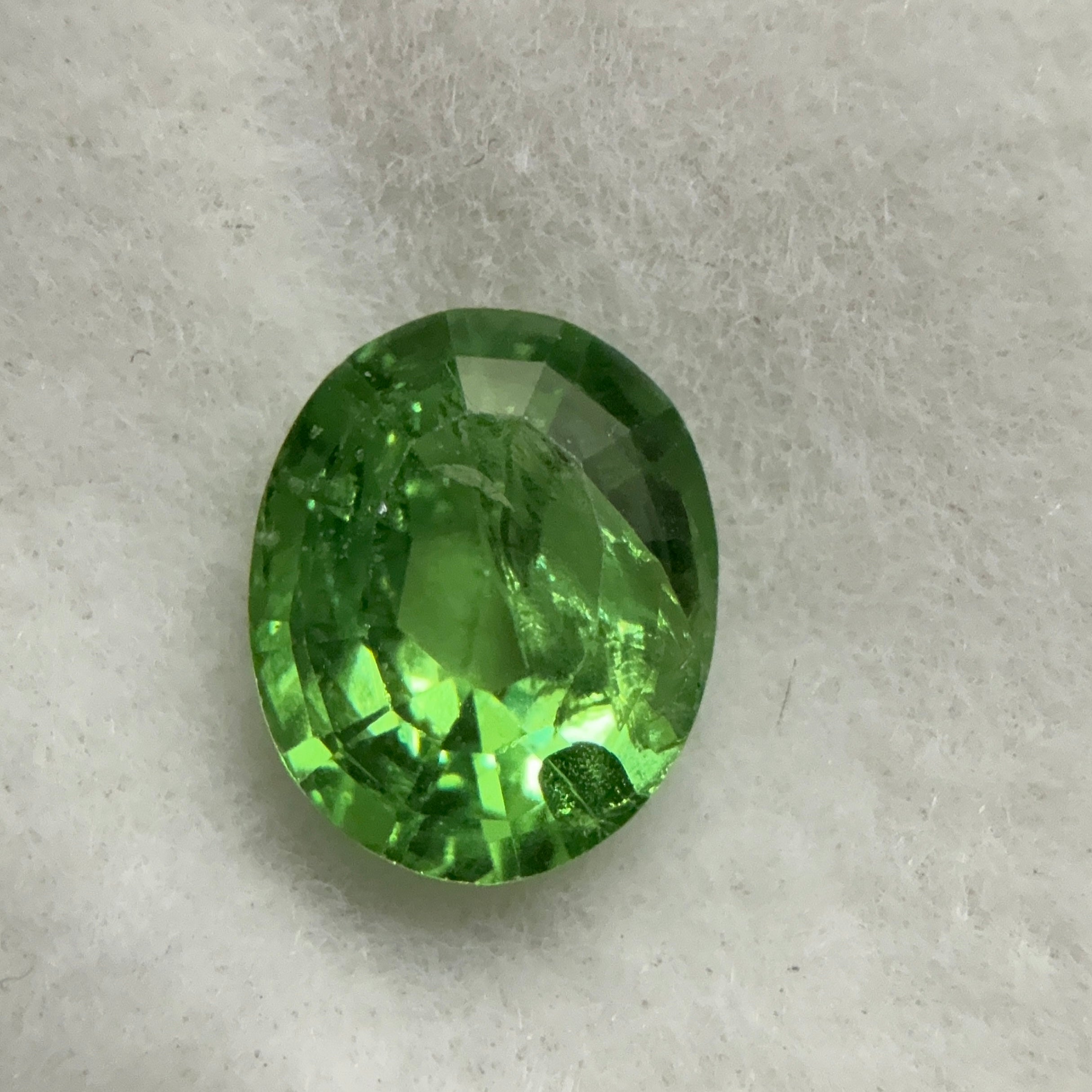 Tsavorite Garnet, 0.90ct, Kenya, Unheated Untreated, slight chip on crown facet, native cut.