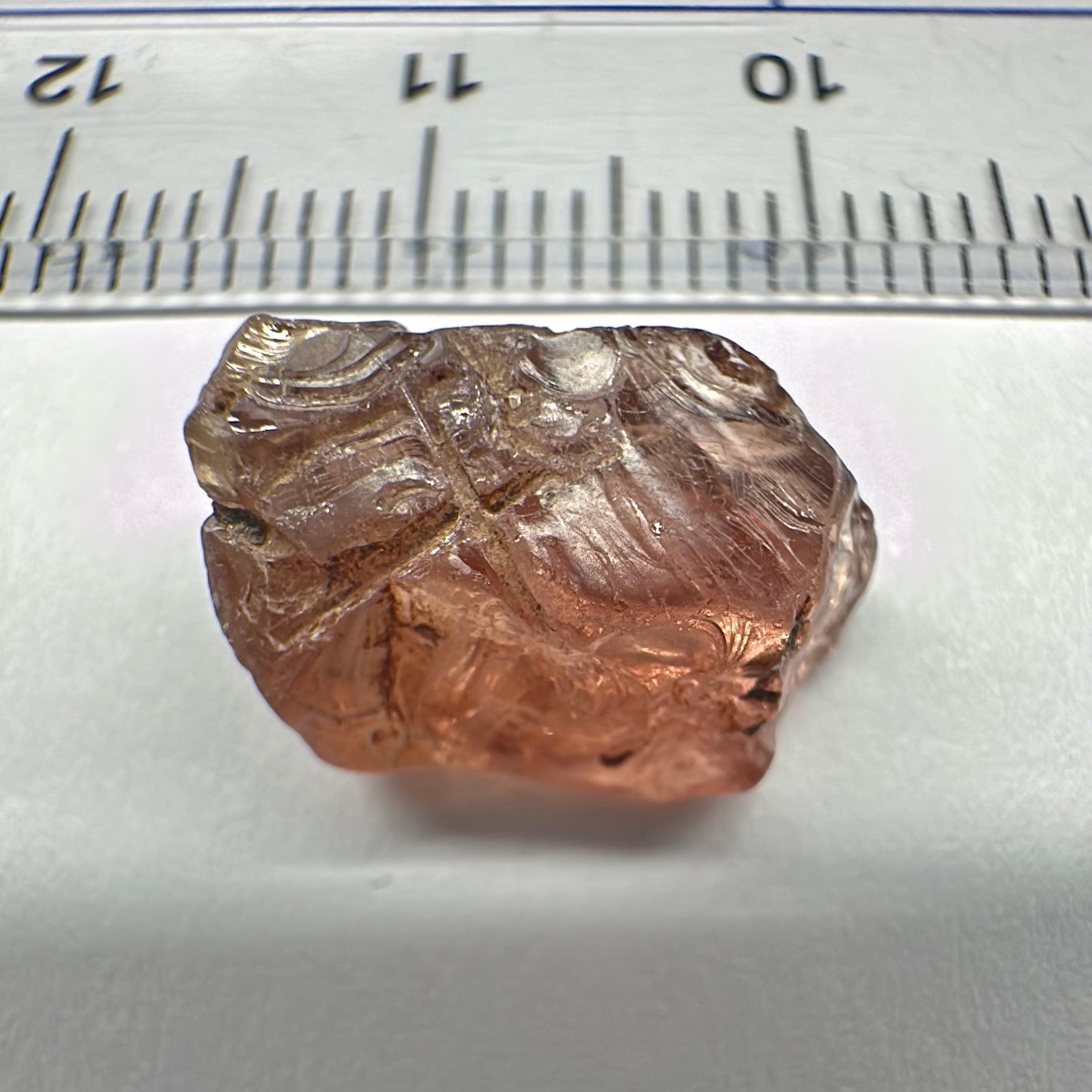 Peach Malaya Garnet, Very Interesting Hollow Pipe inclusions, see all the pictures, 7.38ct, inside vvs-if with slight hollow needle inclusion on the outside, Unheated Untreated, Umba Valley Tanzania