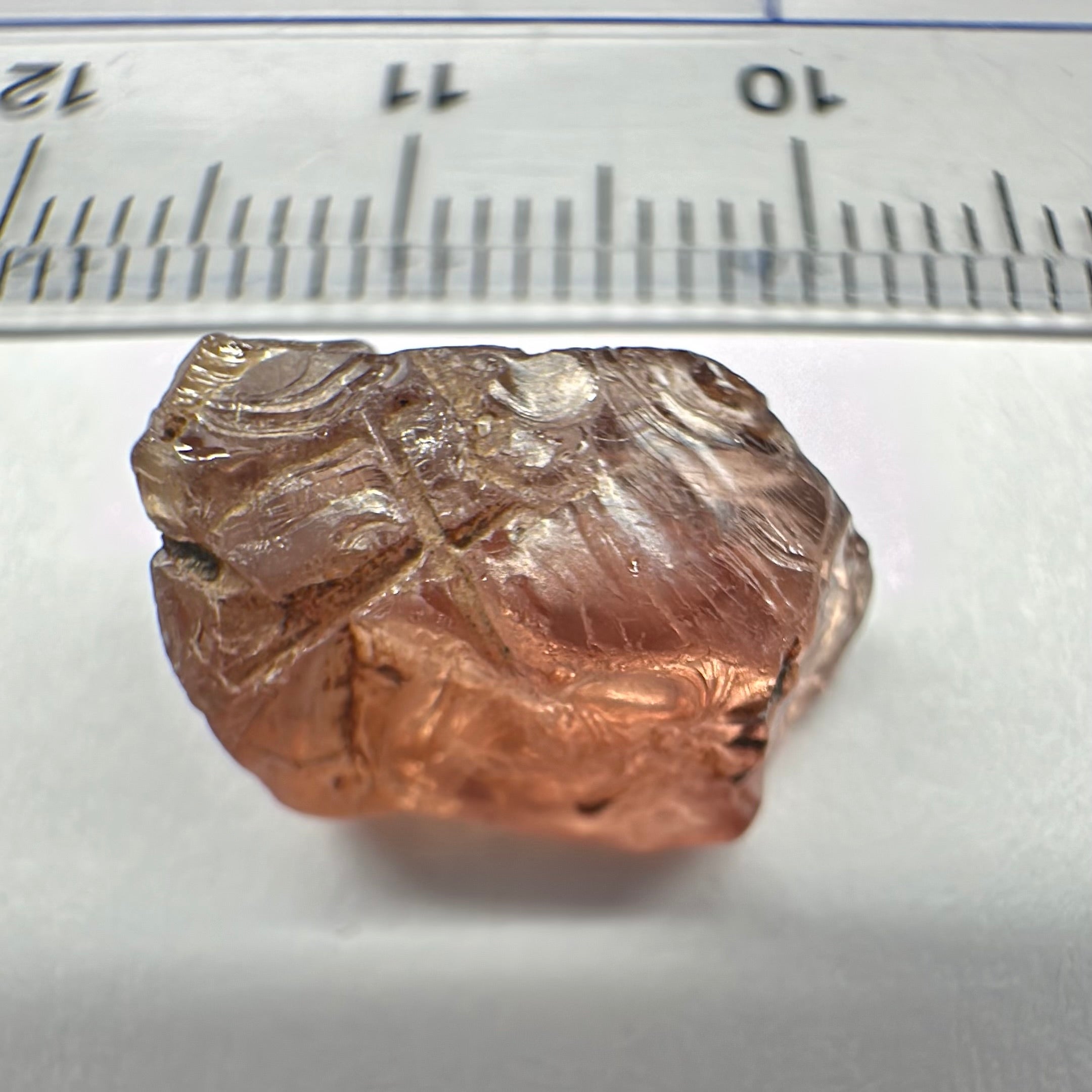 Peach Malaya Garnet, Very Interesting Hollow Pipe inclusions, see all the pictures, 7.38ct, inside vvs-if with slight hollow needle inclusion on the outside, Unheated Untreated, Umba Valley Tanzania