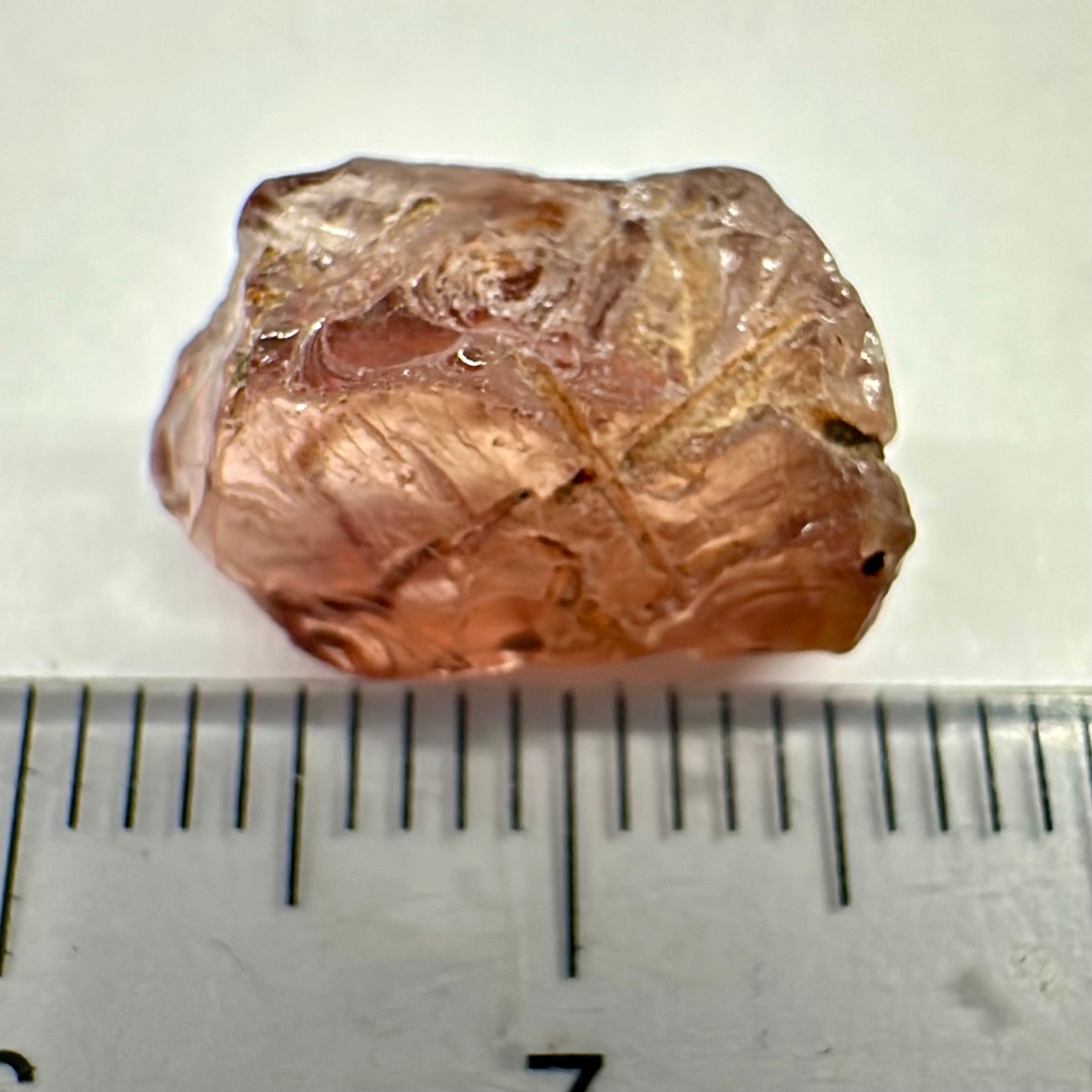 Peach Malaya Garnet, Very Interesting Hollow Pipe inclusions, see all the pictures, 7.38ct, inside vvs-if with slight hollow needle inclusion on the outside, Unheated Untreated, Umba Valley Tanzania