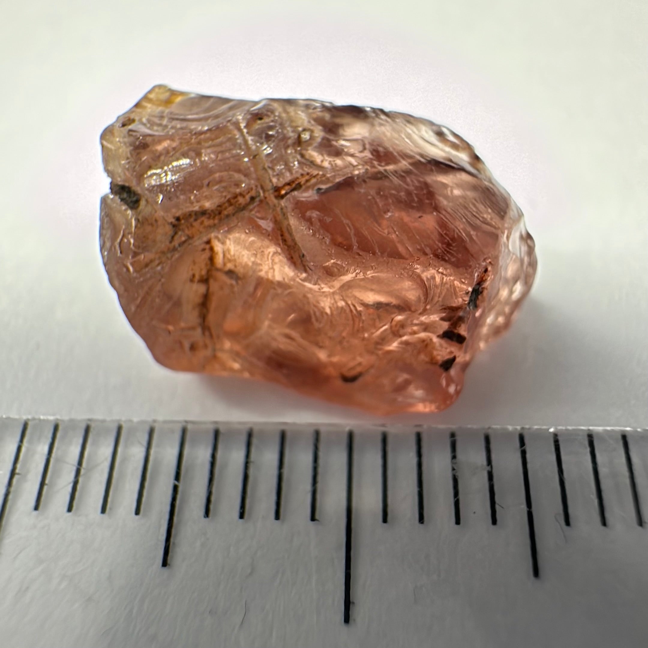 Peach Malaya Garnet, Very Interesting Hollow Pipe inclusions, see all the pictures, 7.38ct, inside vvs-if with slight hollow needle inclusion on the outside, Unheated Untreated, Umba Valley Tanzania