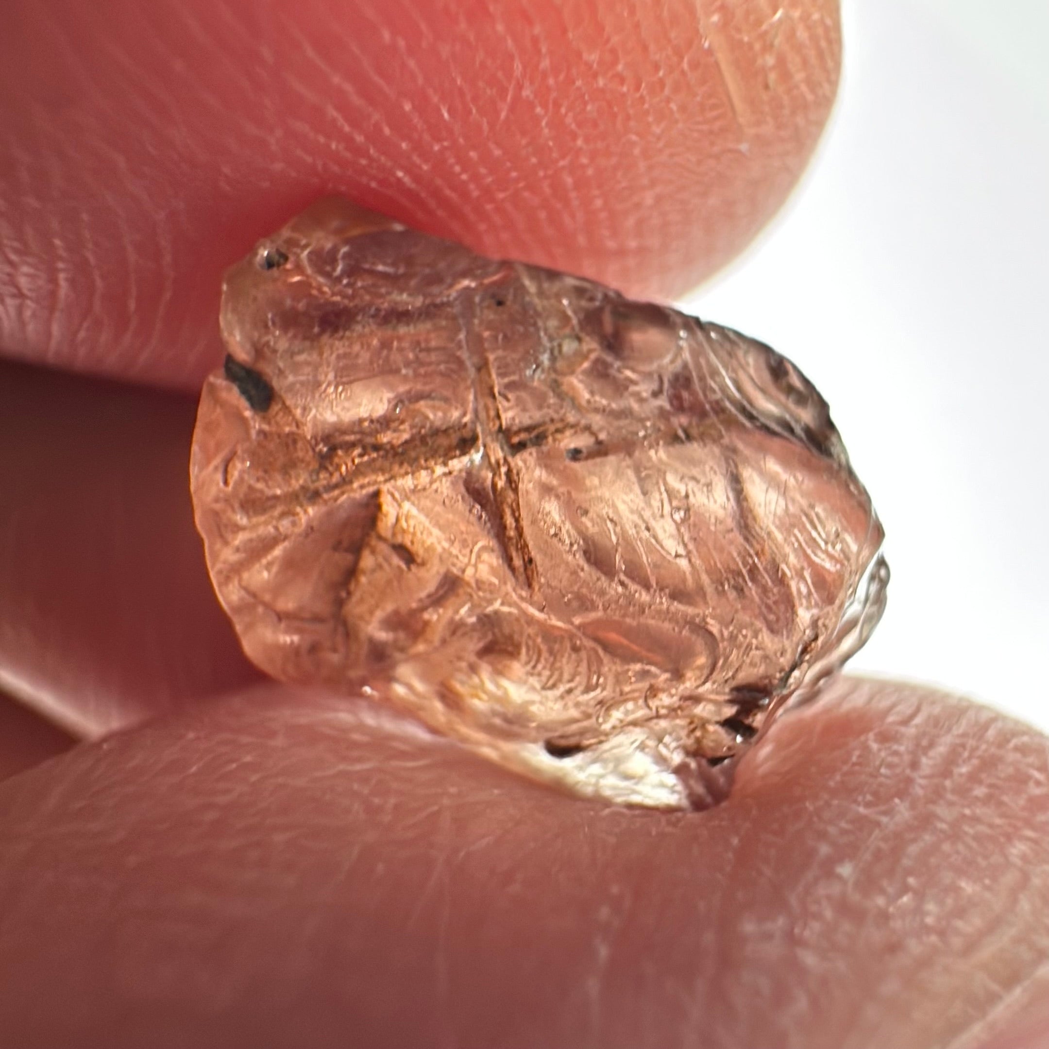 Peach Malaya Garnet, Very Interesting Hollow Pipe inclusions, see all the pictures, 7.38ct, inside vvs-if with slight hollow needle inclusion on the outside, Unheated Untreated, Umba Valley Tanzania