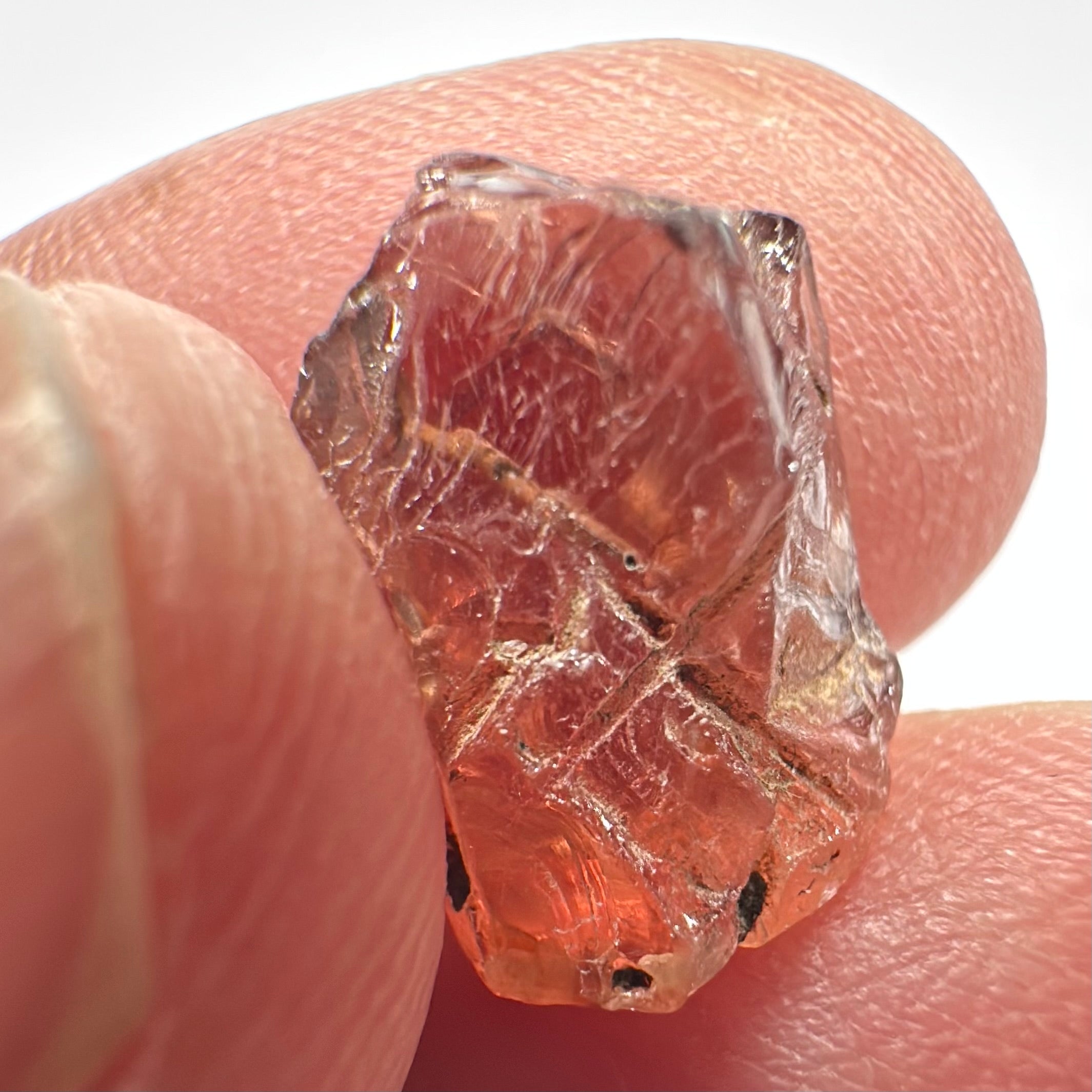 Peach Malaya Garnet, Very Interesting Hollow Pipe inclusions, see all the pictures, 7.38ct, inside vvs-if with slight hollow needle inclusion on the outside, Unheated Untreated, Umba Valley Tanzania