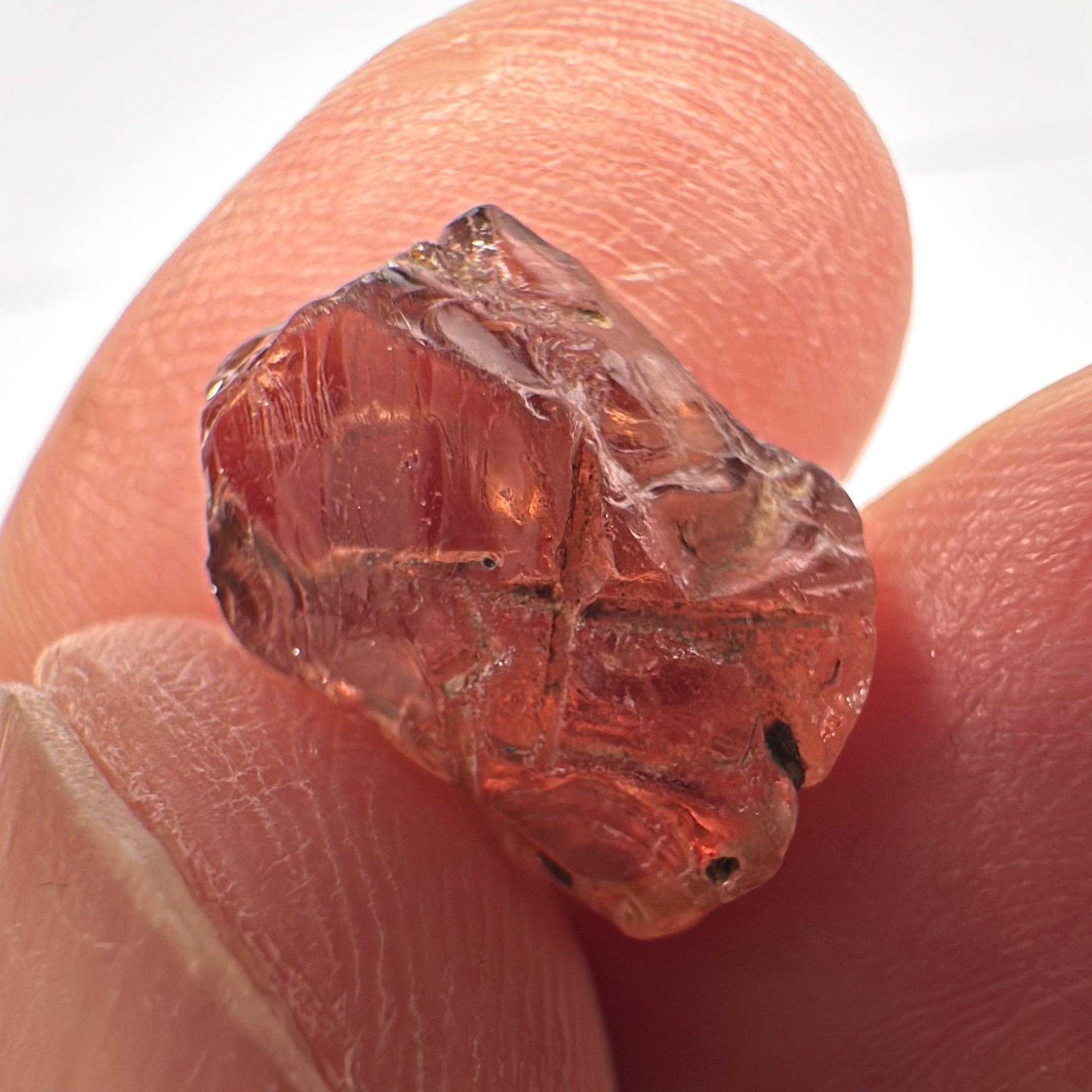 Peach Malaya Garnet, Very Interesting Hollow Pipe inclusions, see all the pictures, 7.38ct, inside vvs-if with slight hollow needle inclusion on the outside, Unheated Untreated, Umba Valley Tanzania