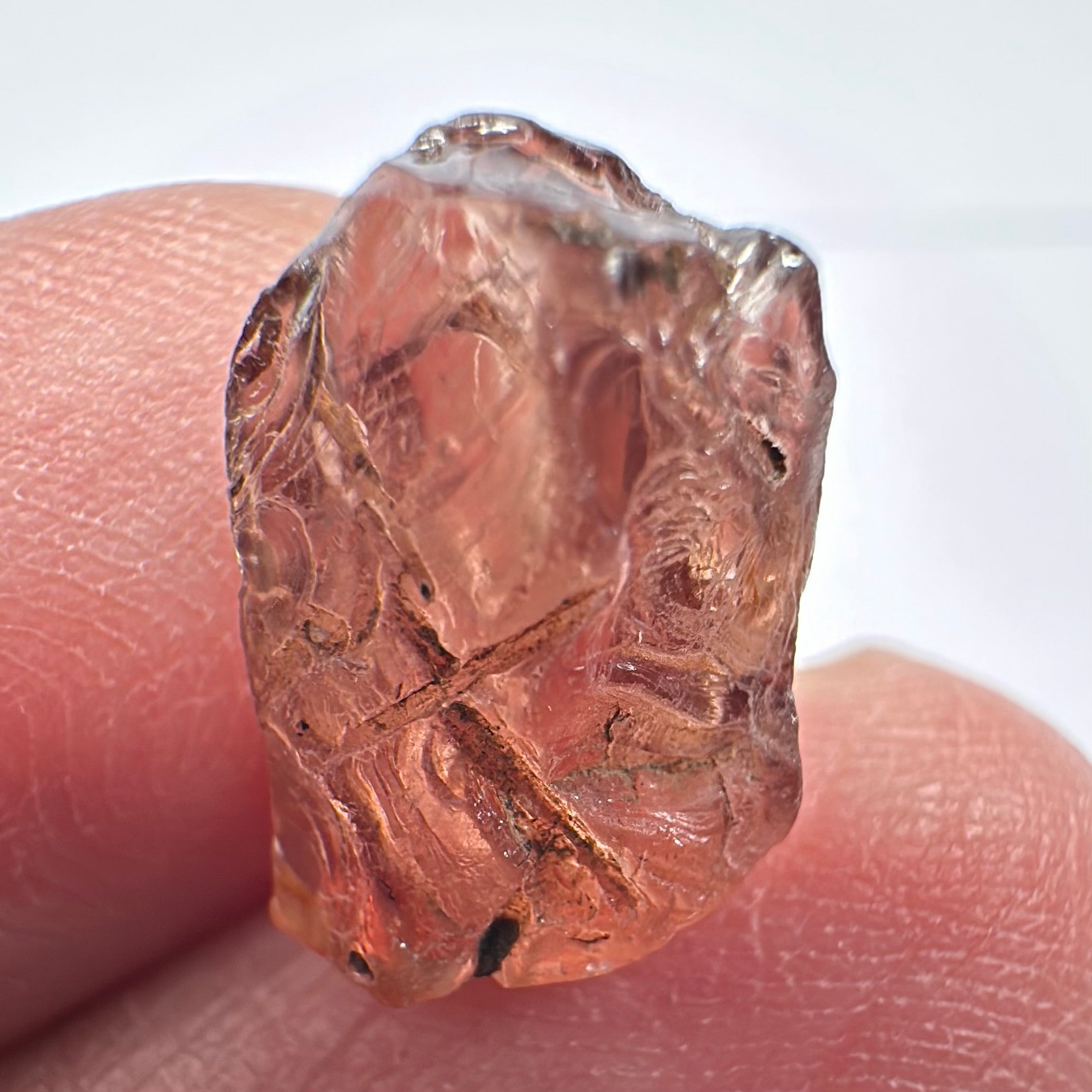 Peach Malaya Garnet, Very Interesting Hollow Pipe inclusions, see all the pictures, 7.38ct, inside vvs-if with slight hollow needle inclusion on the outside, Unheated Untreated, Umba Valley Tanzania