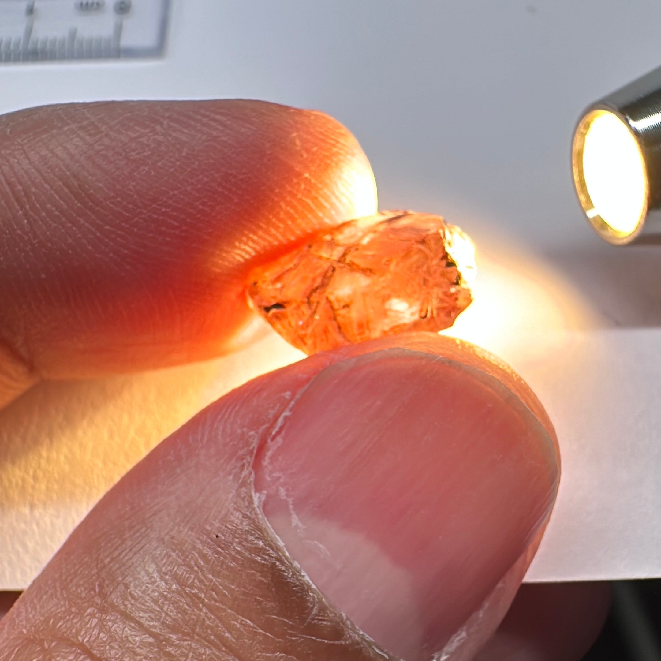 Peach Malaya Garnet, Very Interesting Hollow Pipe inclusions, see all the pictures, 7.38ct, inside vvs-if with slight hollow needle inclusion on the outside, Unheated Untreated, Umba Valley Tanzania