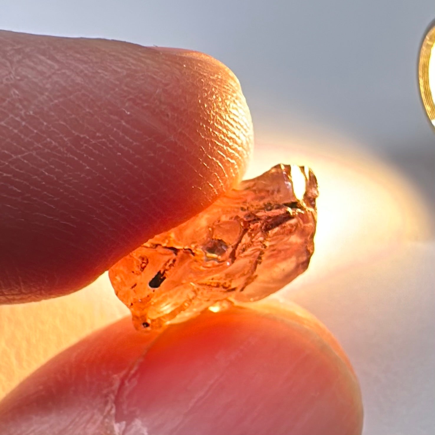 Peach Malaya Garnet, Very Interesting Hollow Pipe inclusions, see all the pictures, 7.38ct, inside vvs-if with slight hollow needle inclusion on the outside, Unheated Untreated, Umba Valley Tanzania