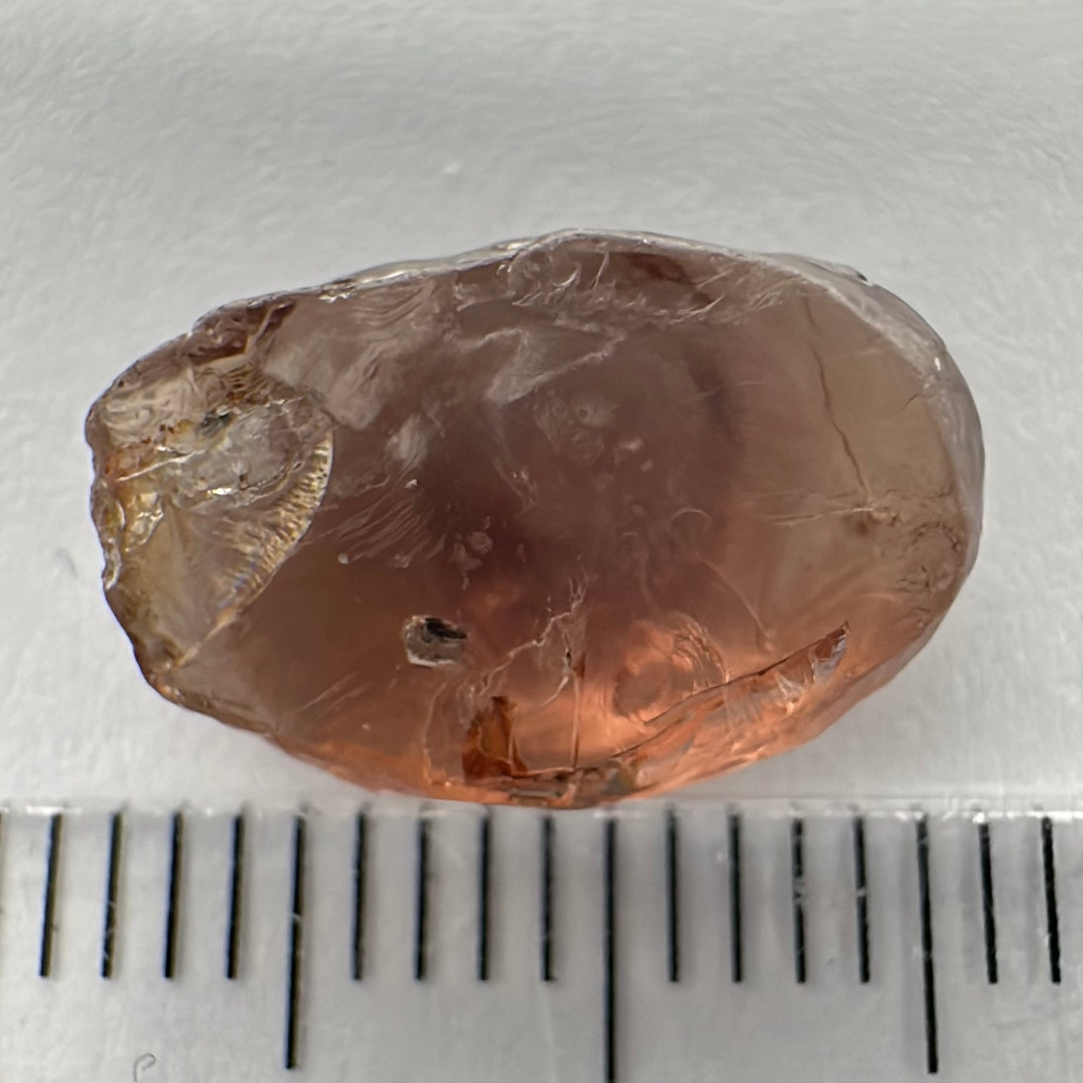 Peach Malaya Garnet, 6.37ct, silk that looks like an eye (see vid.) with a crystal inclusion on the side, flat stone , Unheated Untreated, Umba Valley Tanzania. See pictures to get the exact idea of depth