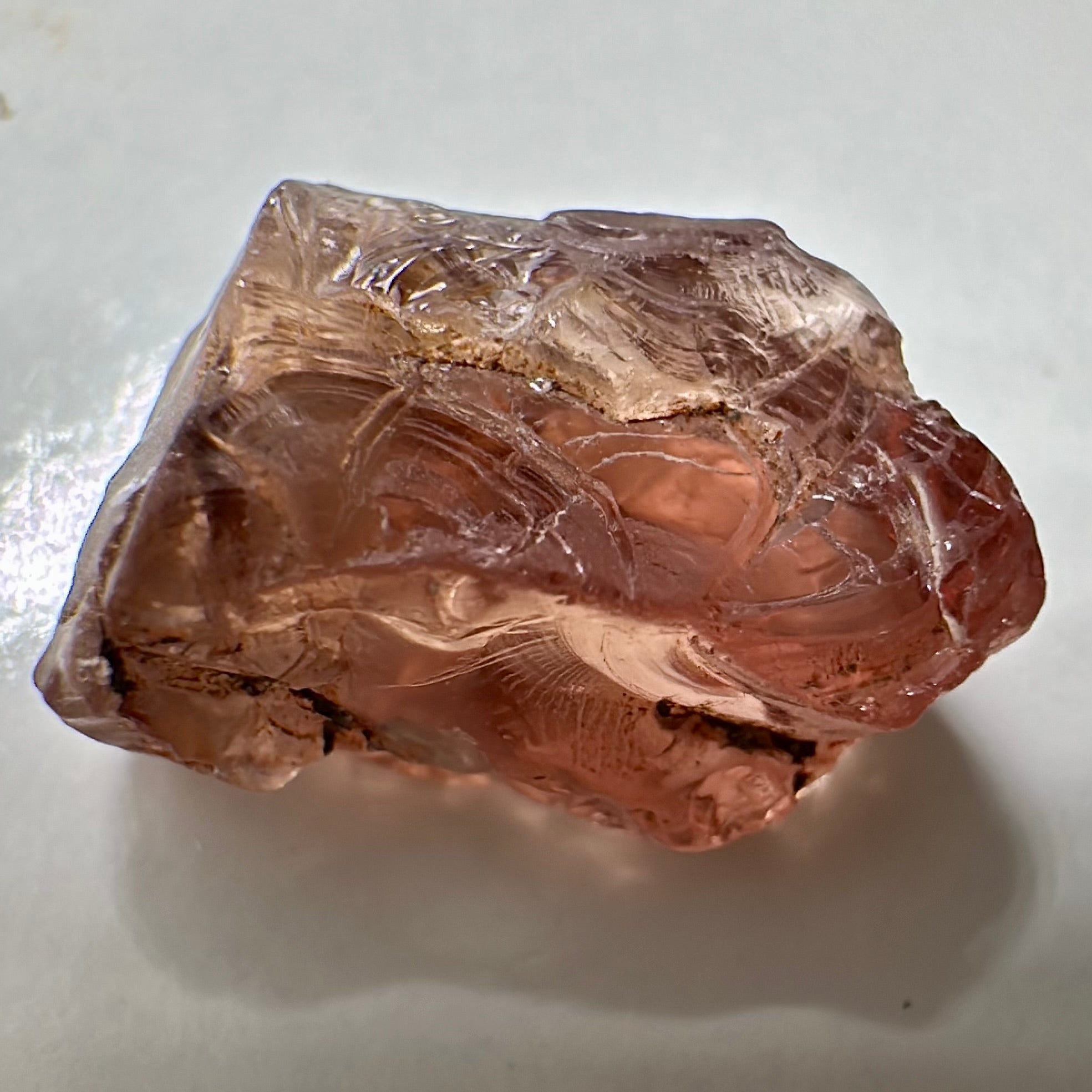 Peach Malaya Garnet, Very Interesting Hollow Pipe inclusions, see all the pictures, 7.38ct, inside vvs-if with slight hollow needle inclusion on the outside, Unheated Untreated, Umba Valley Tanzania