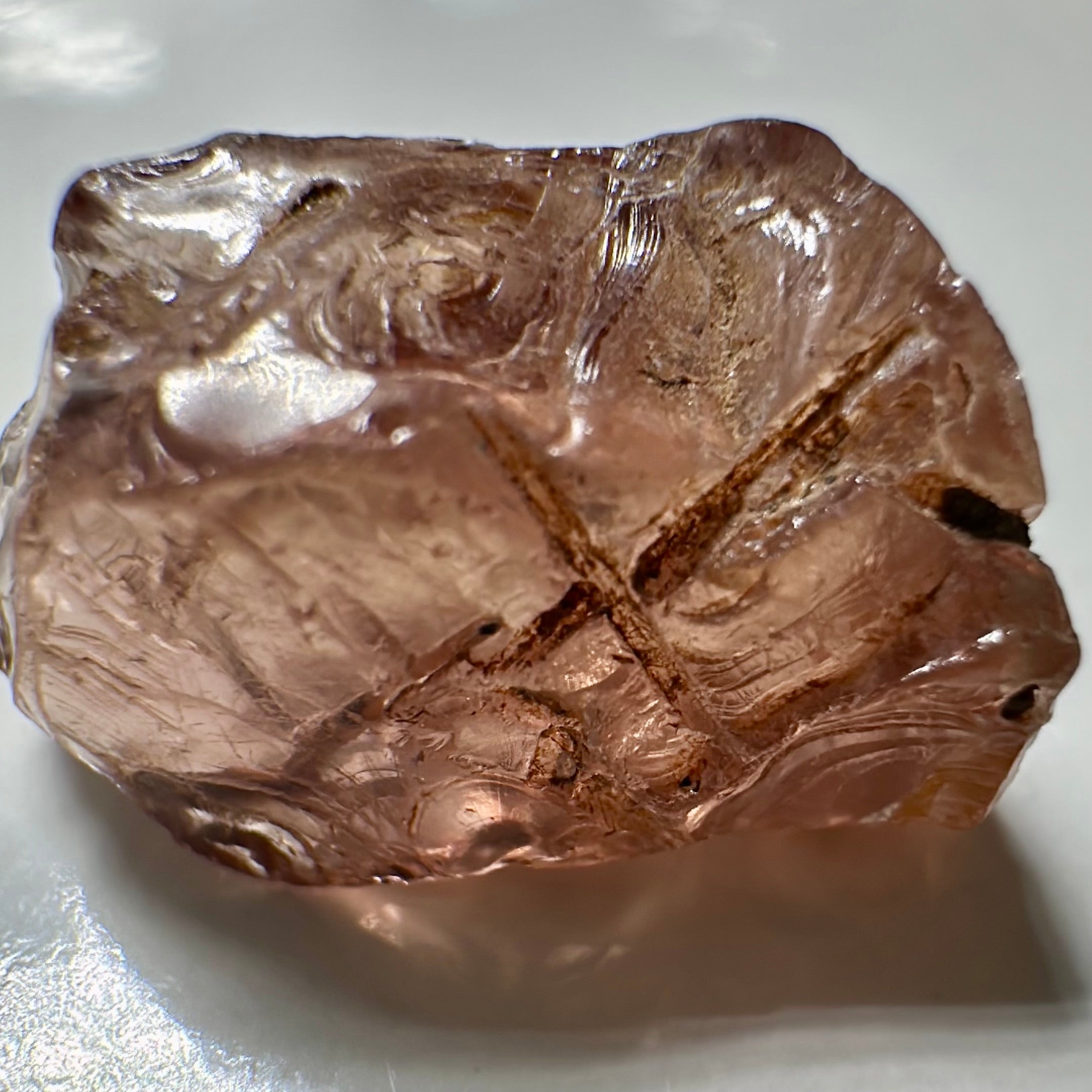 Peach Malaya Garnet, Very Interesting Hollow Pipe inclusions, see all the pictures, 7.38ct, inside vvs-if with slight hollow needle inclusion on the outside, Unheated Untreated, Umba Valley Tanzania