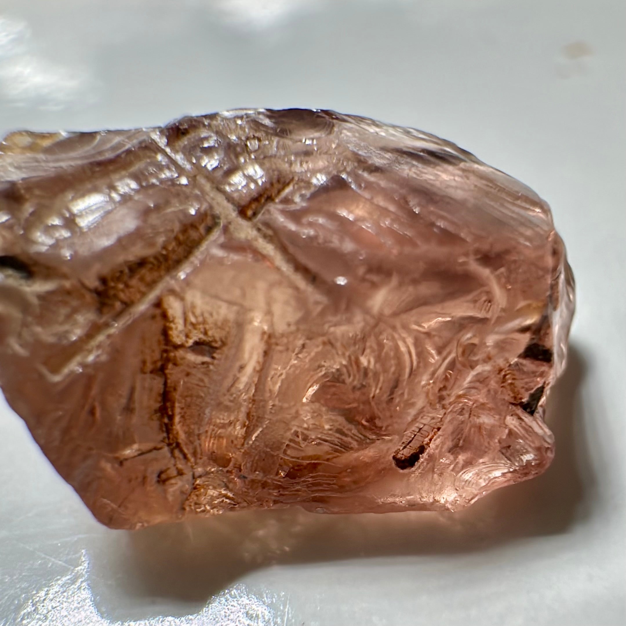 Peach Malaya Garnet, Very Interesting Hollow Pipe inclusions, see all the pictures, 7.38ct, inside vvs-if with slight hollow needle inclusion on the outside, Unheated Untreated, Umba Valley Tanzania