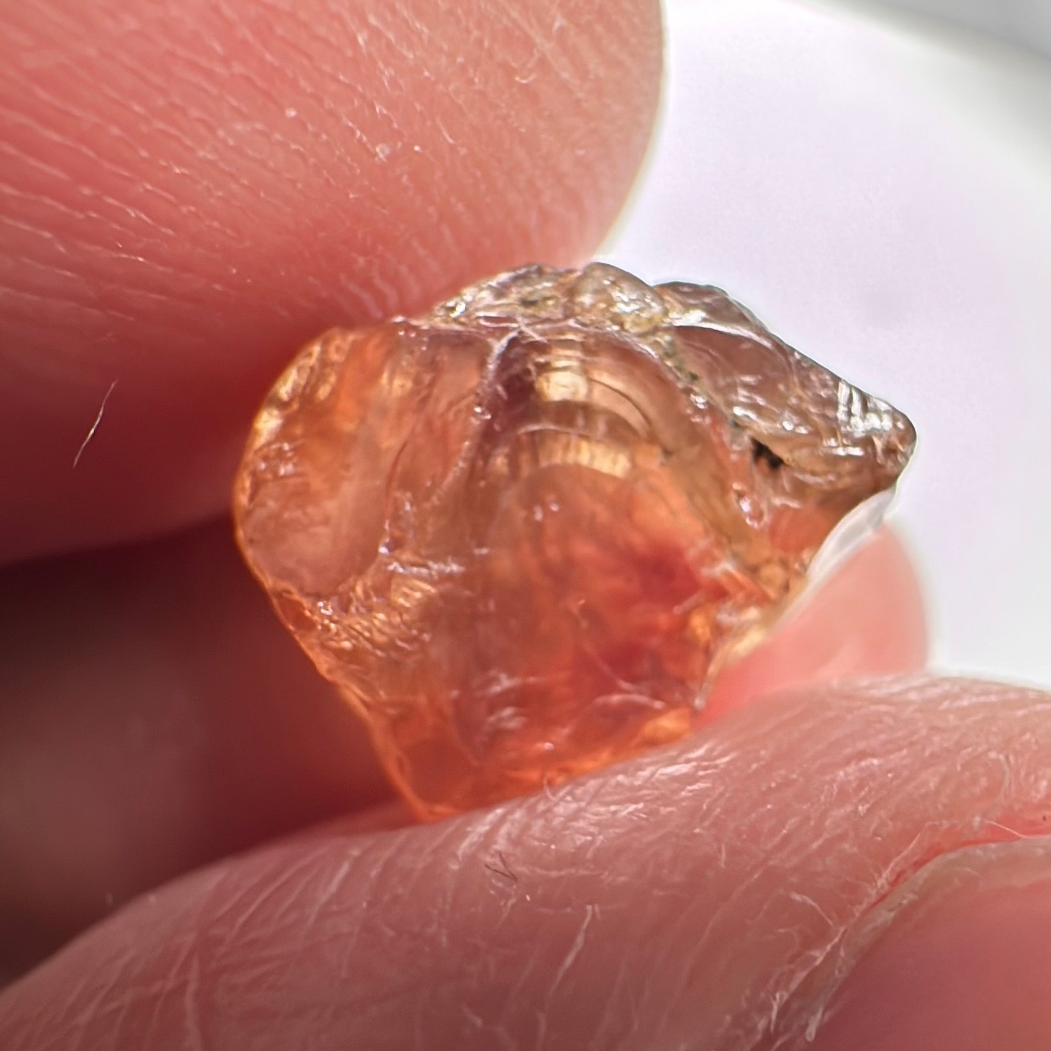 Peach Malaya Garnet, 8.21ct, silk and slight needles but no inclusions, Unheated Untreated, Umba Valley Tanzania, complicated shape.