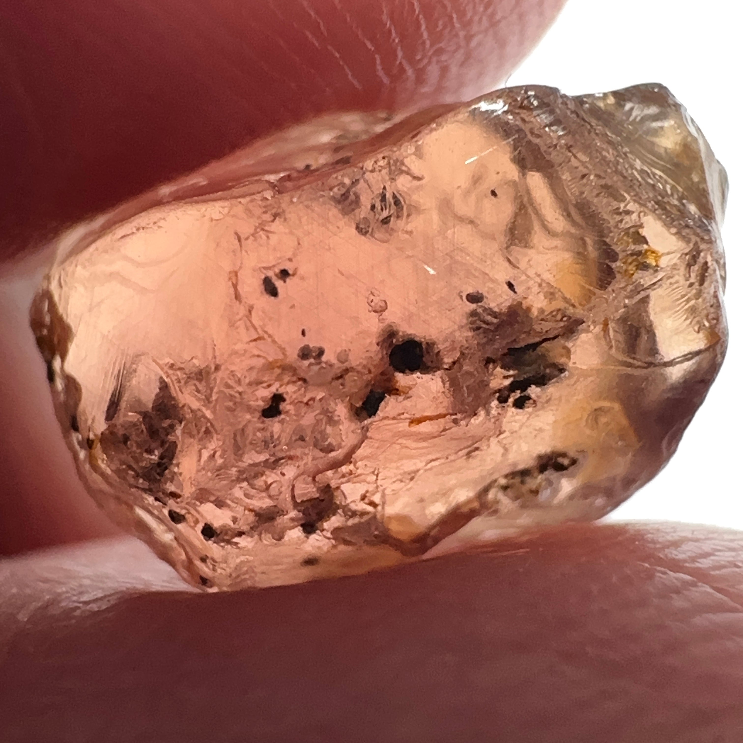 Peach Malaya Garnet, 11.56ct, silk and very fine needles, some inclusions (spots) on the outside of the stone that will come off on preforming,  Unheated Untreated, Umba Valley Tanzania