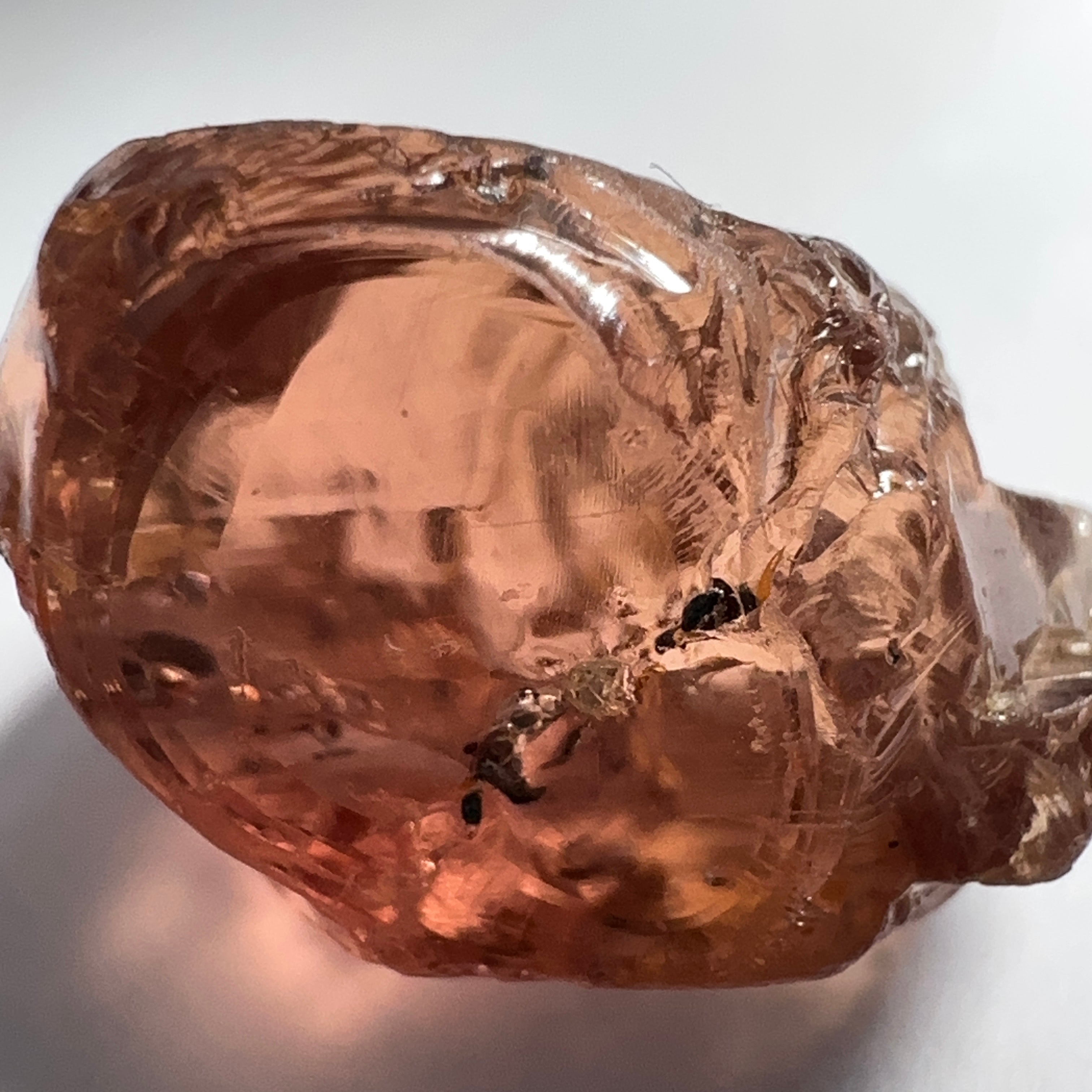 Peach Malaya Garnet, 11.56ct, silk and very fine needles, some inclusions (spots) on the outside of the stone that will come off on preforming,  Unheated Untreated, Umba Valley Tanzania