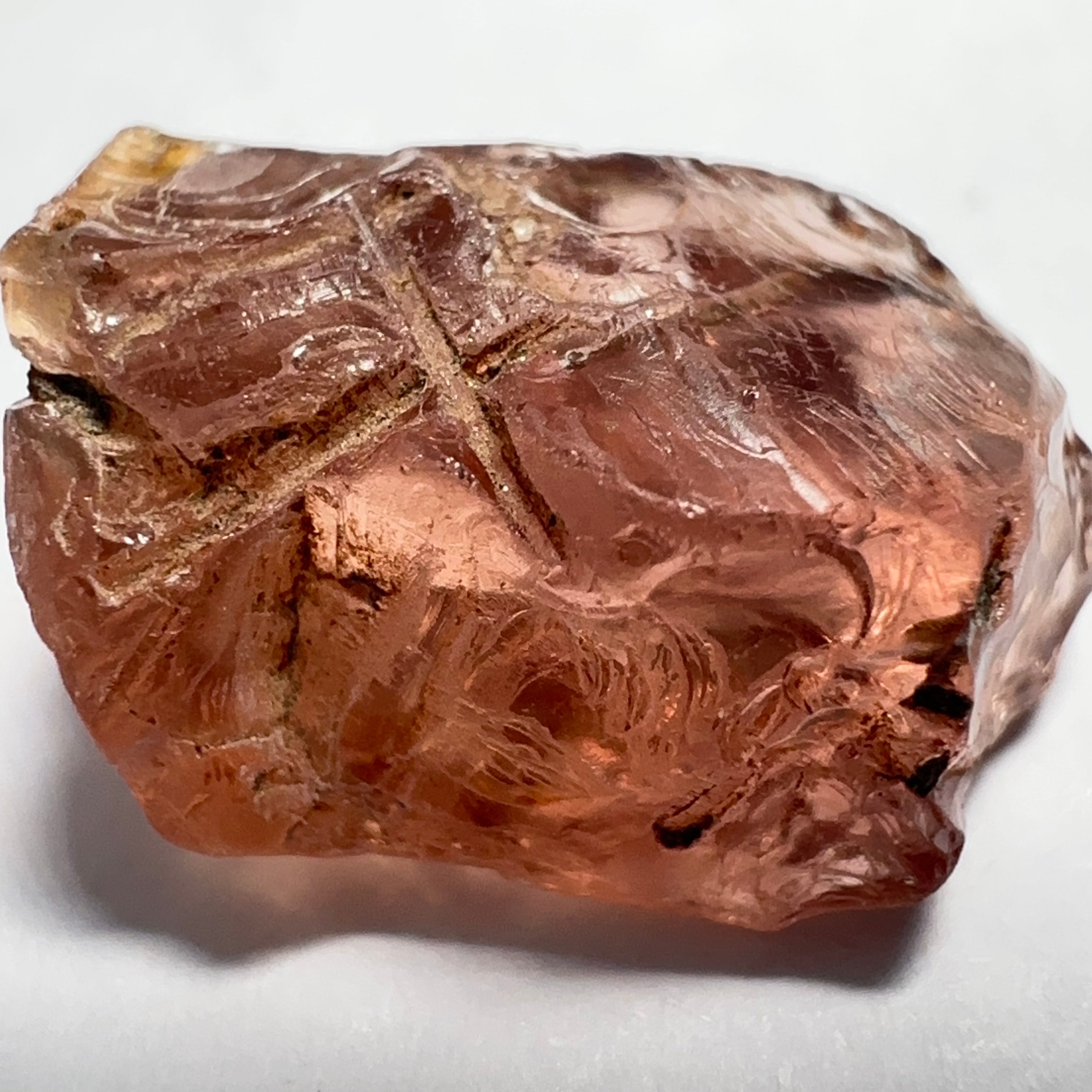 Peach Malaya Garnet, Very Interesting Hollow Pipe inclusions, see all the pictures, 7.38ct, inside vvs-if with slight hollow needle inclusion on the outside, Unheated Untreated, Umba Valley Tanzania