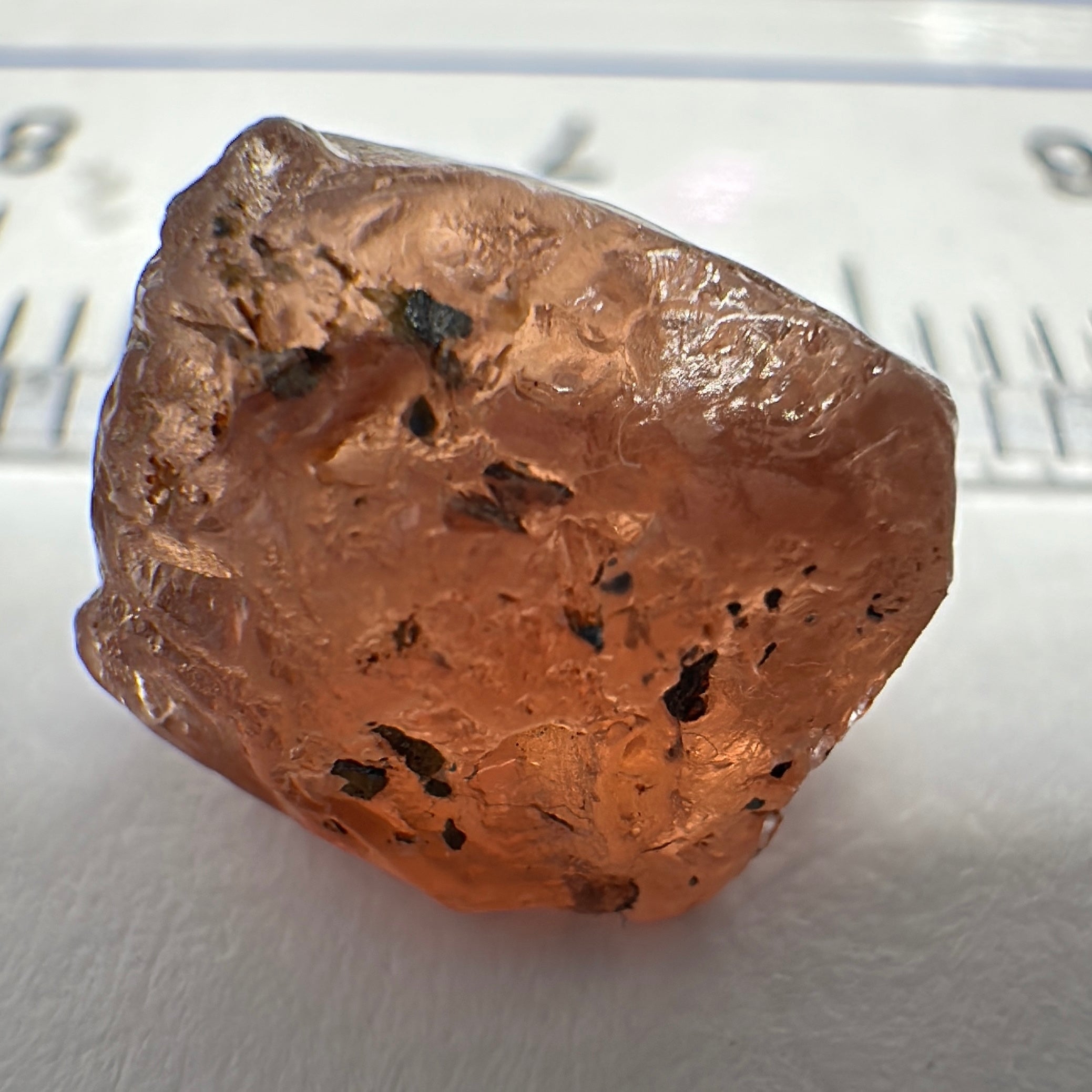 Peach Malaya Garnet, 6.02ct, slight crack 1mm inside from skin, slight gunk on skin on one end needs to be removed on disk, rest slightly silky, Unheated Untreated, Umba Valley Tanzania