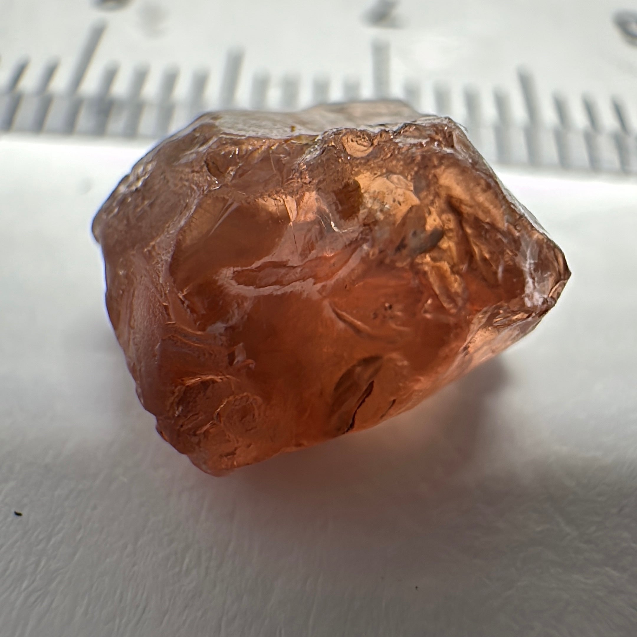 Peach Malaya Garnet, 6.02ct, slight crack 1mm inside from skin, slight gunk on skin on one end needs to be removed on disk, rest slightly silky, Unheated Untreated, Umba Valley Tanzania