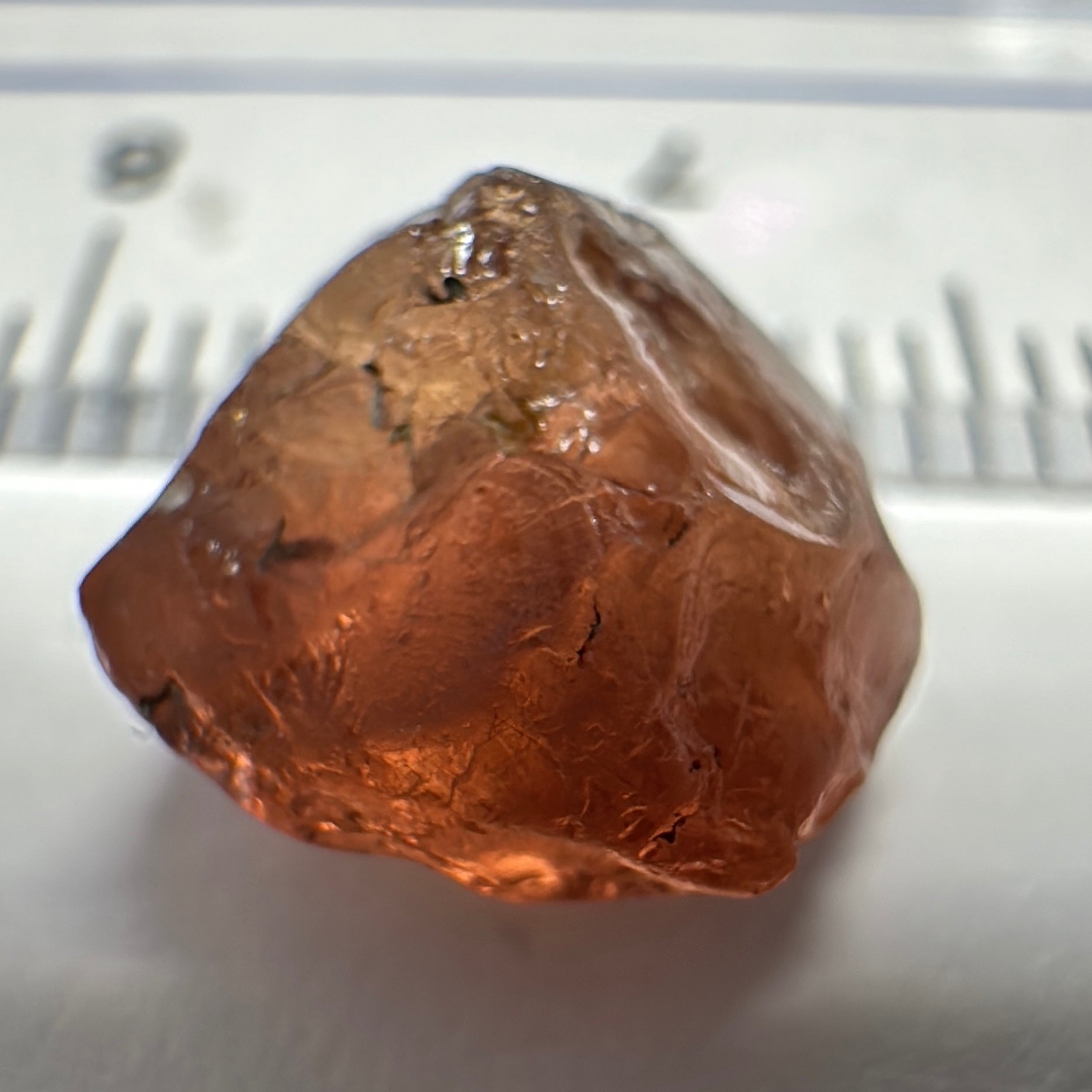 Peach Malaya Garnet, 6.02ct, slight crack 1mm inside from skin, slight gunk on skin on one end needs to be removed on disk, rest slightly silky, Unheated Untreated, Umba Valley Tanzania