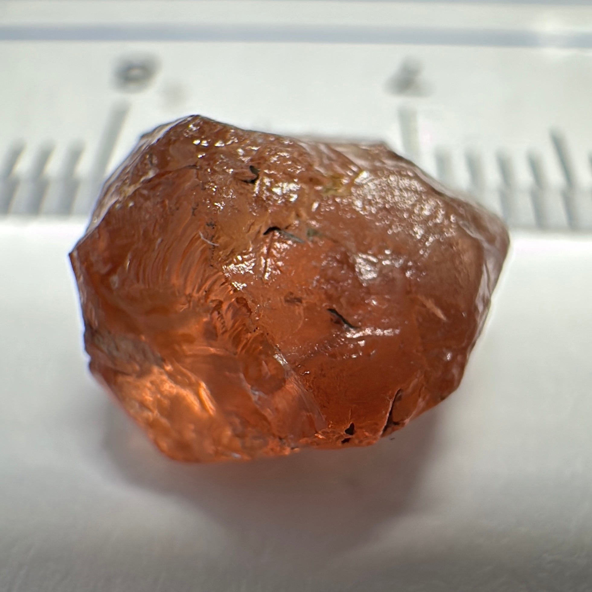 Peach Malaya Garnet, 6.02ct, slight crack 1mm inside from skin, slight gunk on skin on one end needs to be removed on disk, rest slightly silky, Unheated Untreated, Umba Valley Tanzania