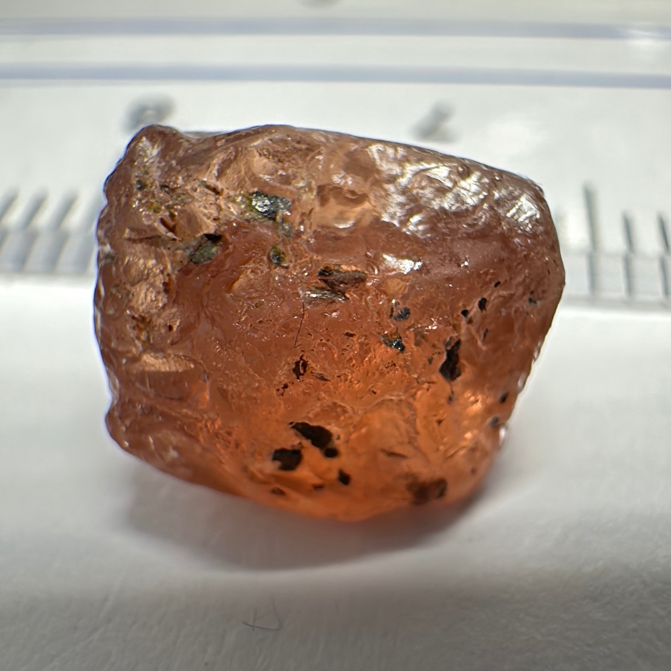 Peach Malaya Garnet, 6.02ct, slight crack 1mm inside from skin, slight gunk on skin on one end needs to be removed on disk, rest slightly silky, Unheated Untreated, Umba Valley Tanzania