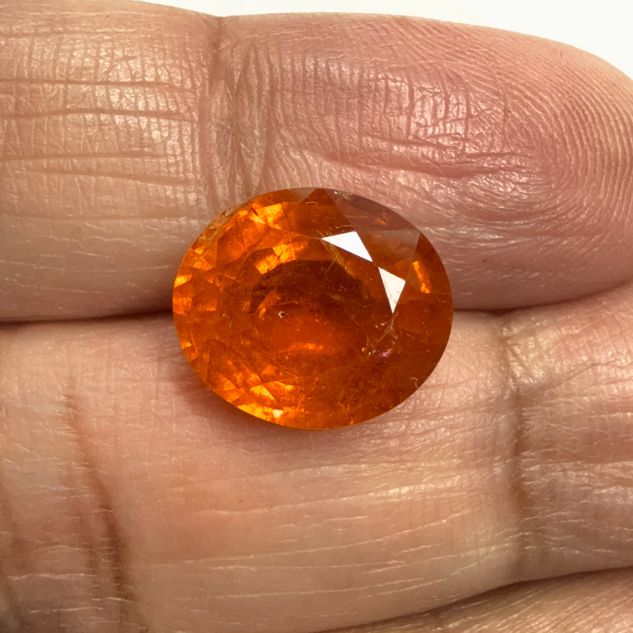 Mandarin Spessartite Garnet, 9.09ct, Untreated Unheated. 12.8 x 11.2 x 6.8mm, stone has some veils, slight sugar and inclusions