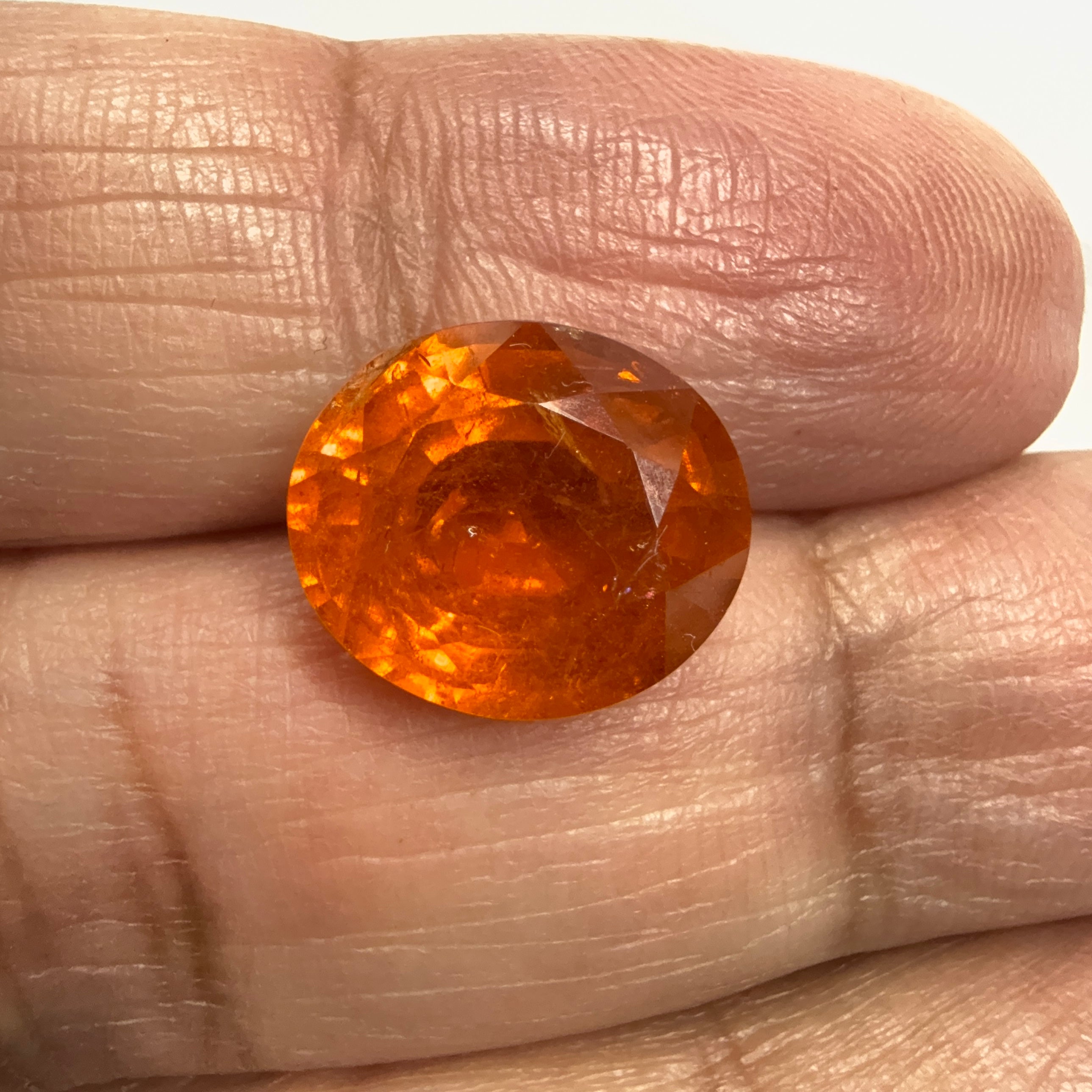 Mandarin Spessartite Garnet, 9.09ct, Untreated Unheated. 12.8 x 11.2 x 6.8mm, stone has some veils, slight sugar and inclusions