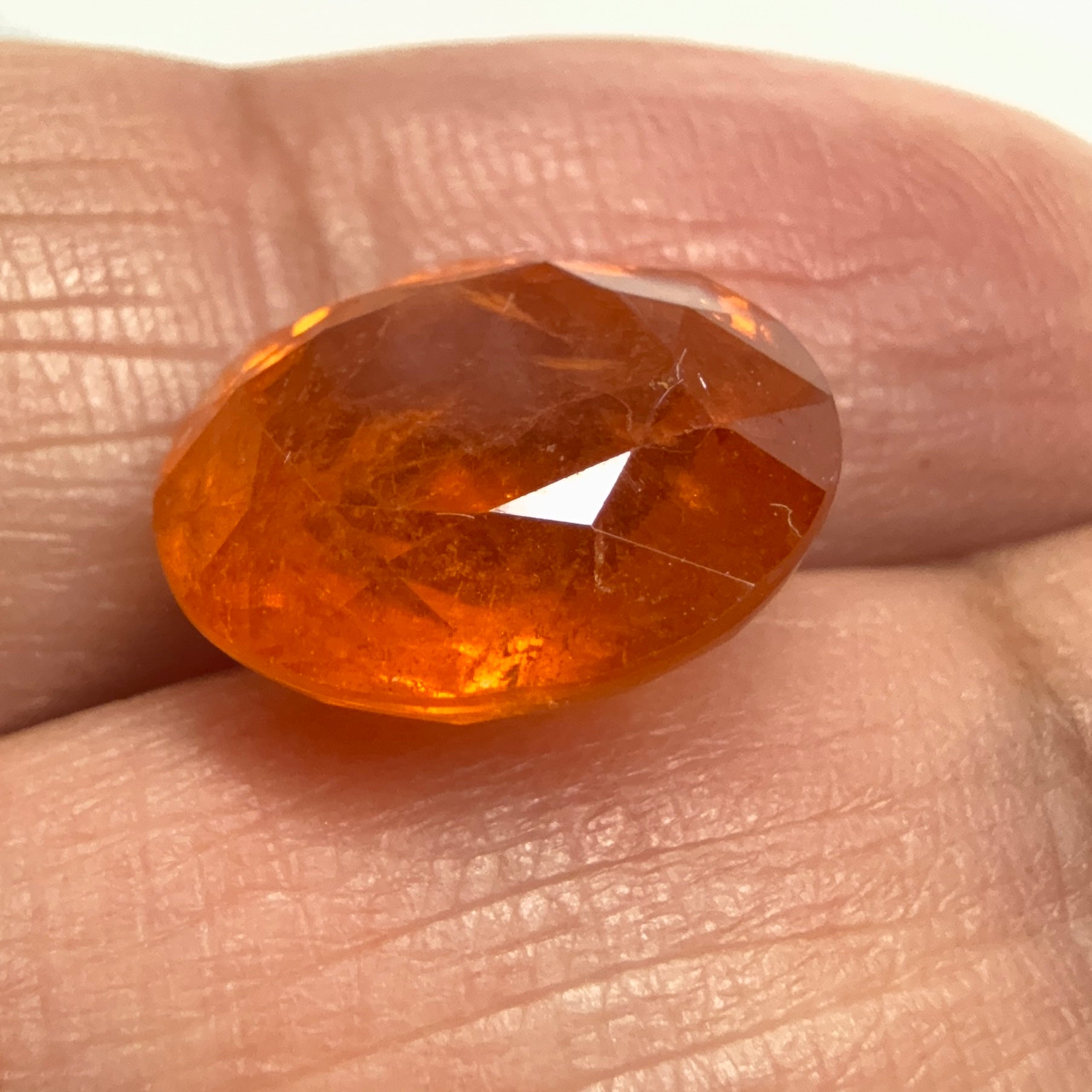 Mandarin Spessartite Garnet, 9.09ct, Untreated Unheated. 12.8 x 11.2 x 6.8mm, stone has some veils, slight sugar and inclusions