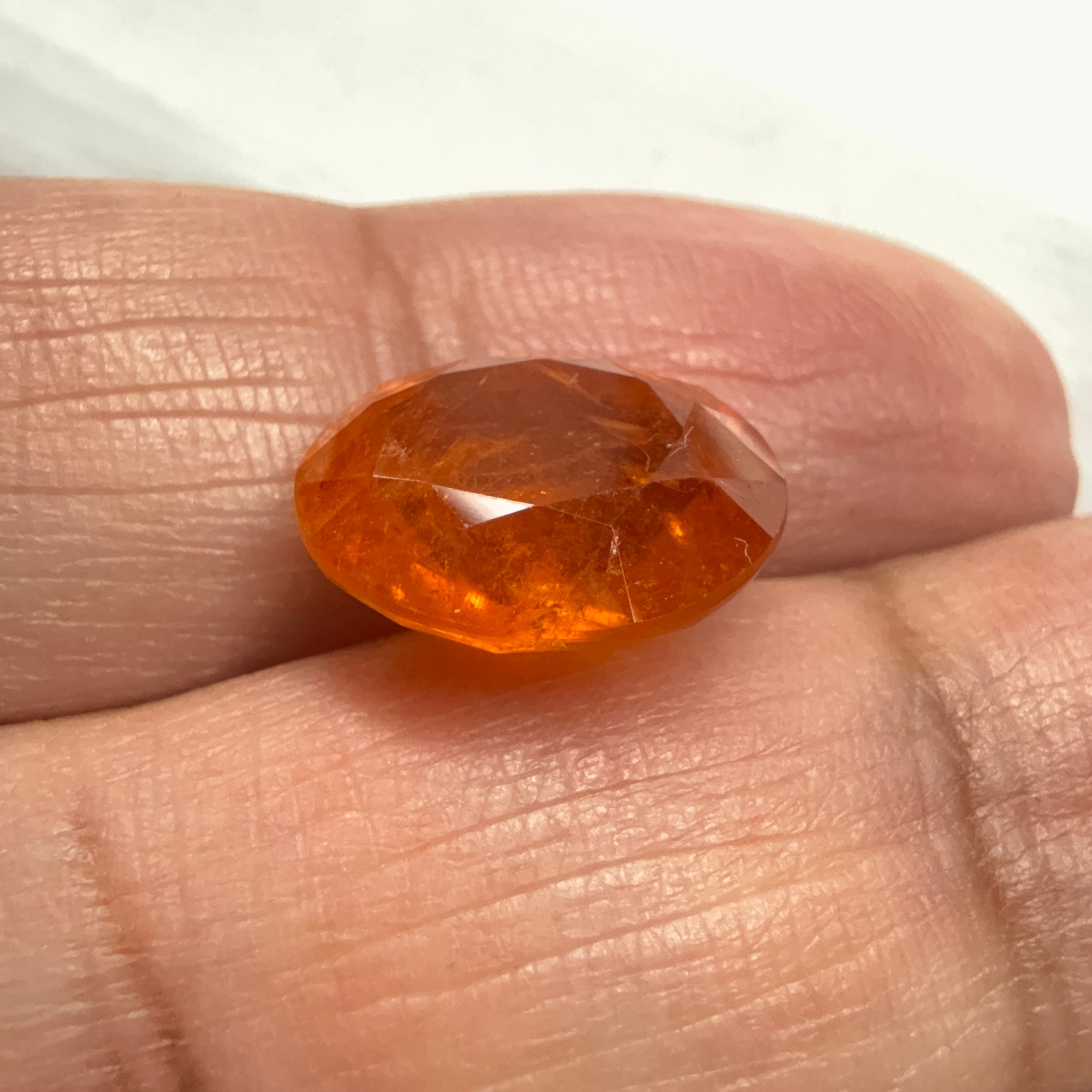 Mandarin Spessartite Garnet, 9.09ct, Untreated Unheated. 12.8 x 11.2 x 6.8mm, stone has some veils, slight sugar and inclusions