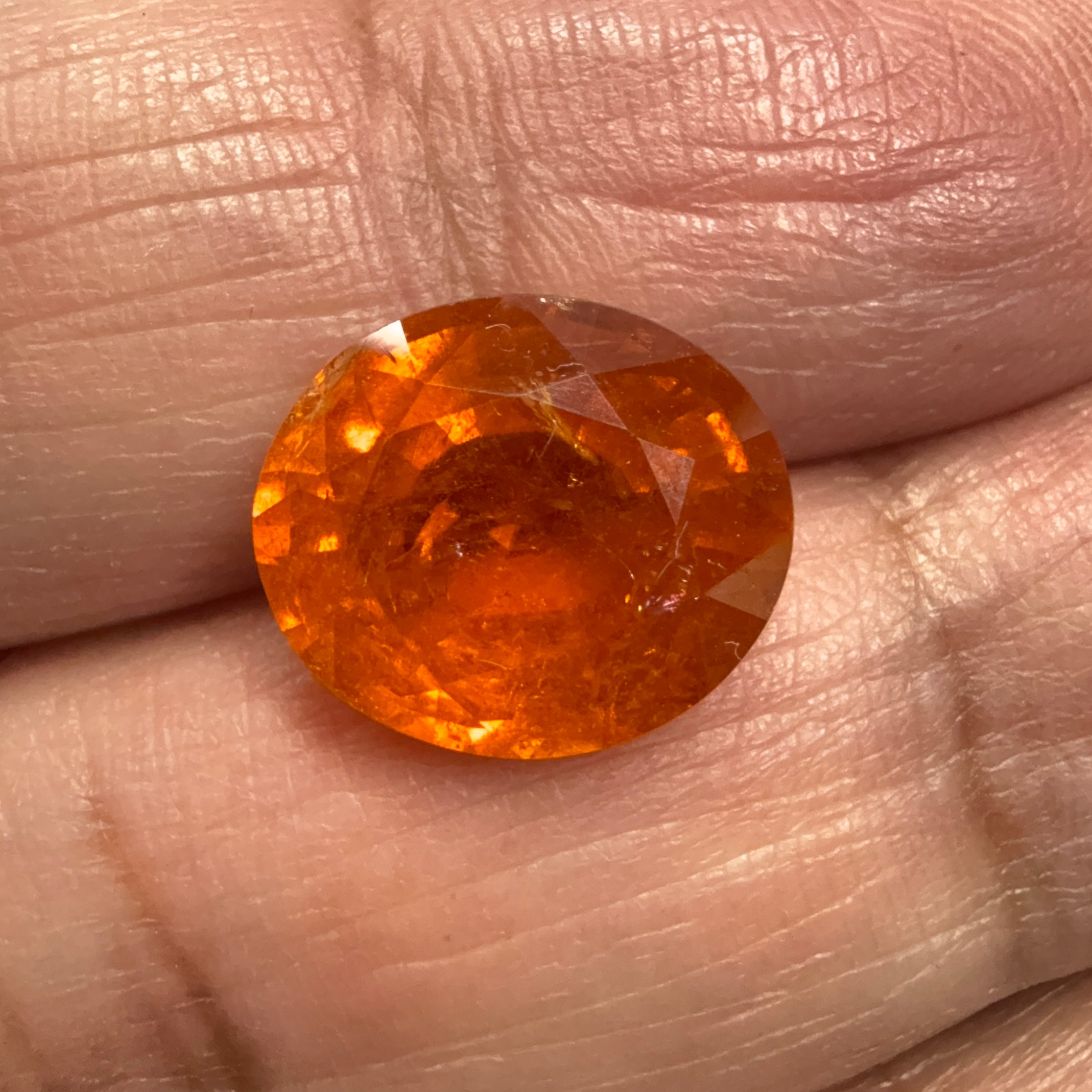 Mandarin Spessartite Garnet, 9.09ct, Untreated Unheated. 12.8 x 11.2 x 6.8mm, stone has some veils, slight sugar and inclusions