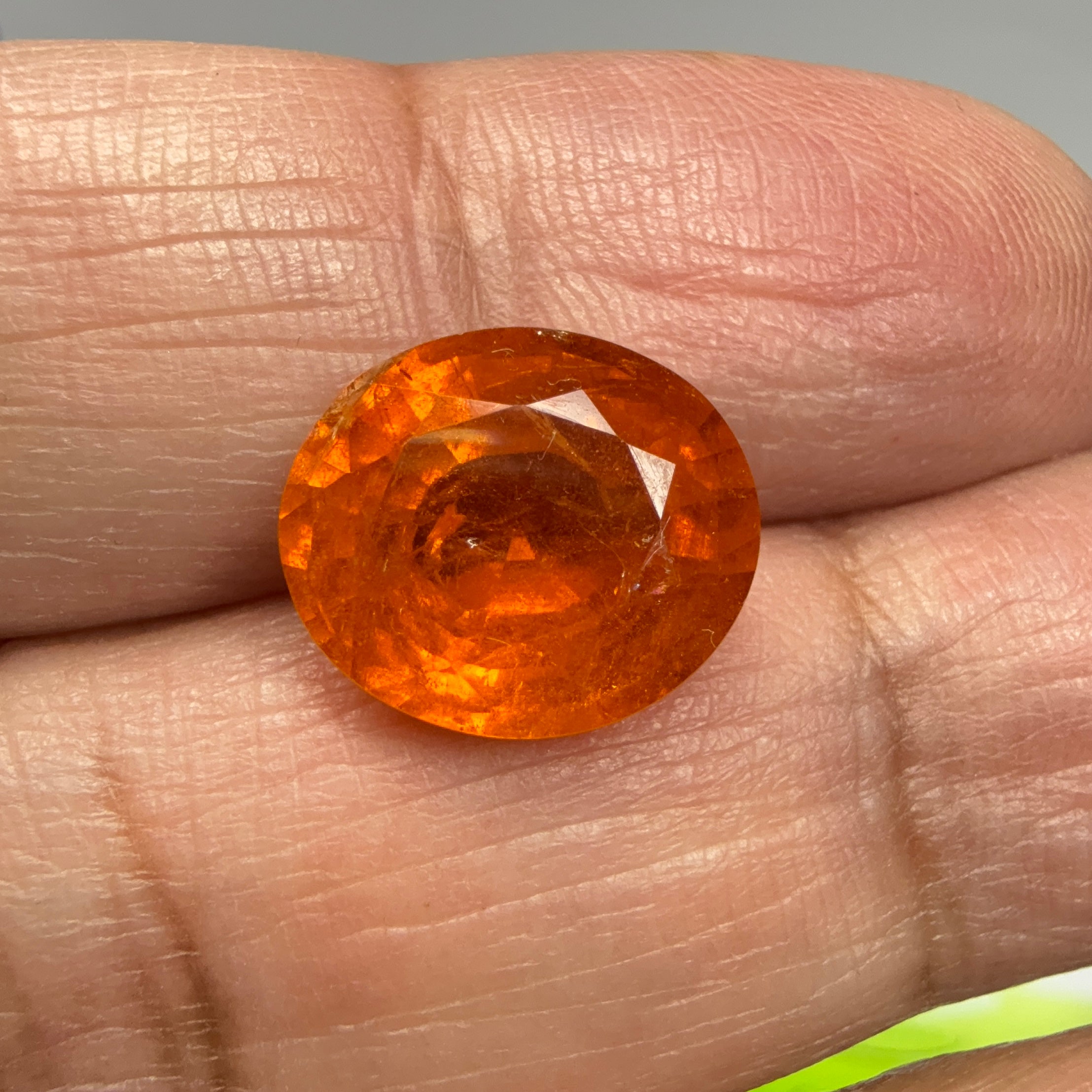 Mandarin Spessartite Garnet, 9.09ct, Untreated Unheated. 12.8 x 11.2 x 6.8mm, stone has some veils, slight sugar and inclusions