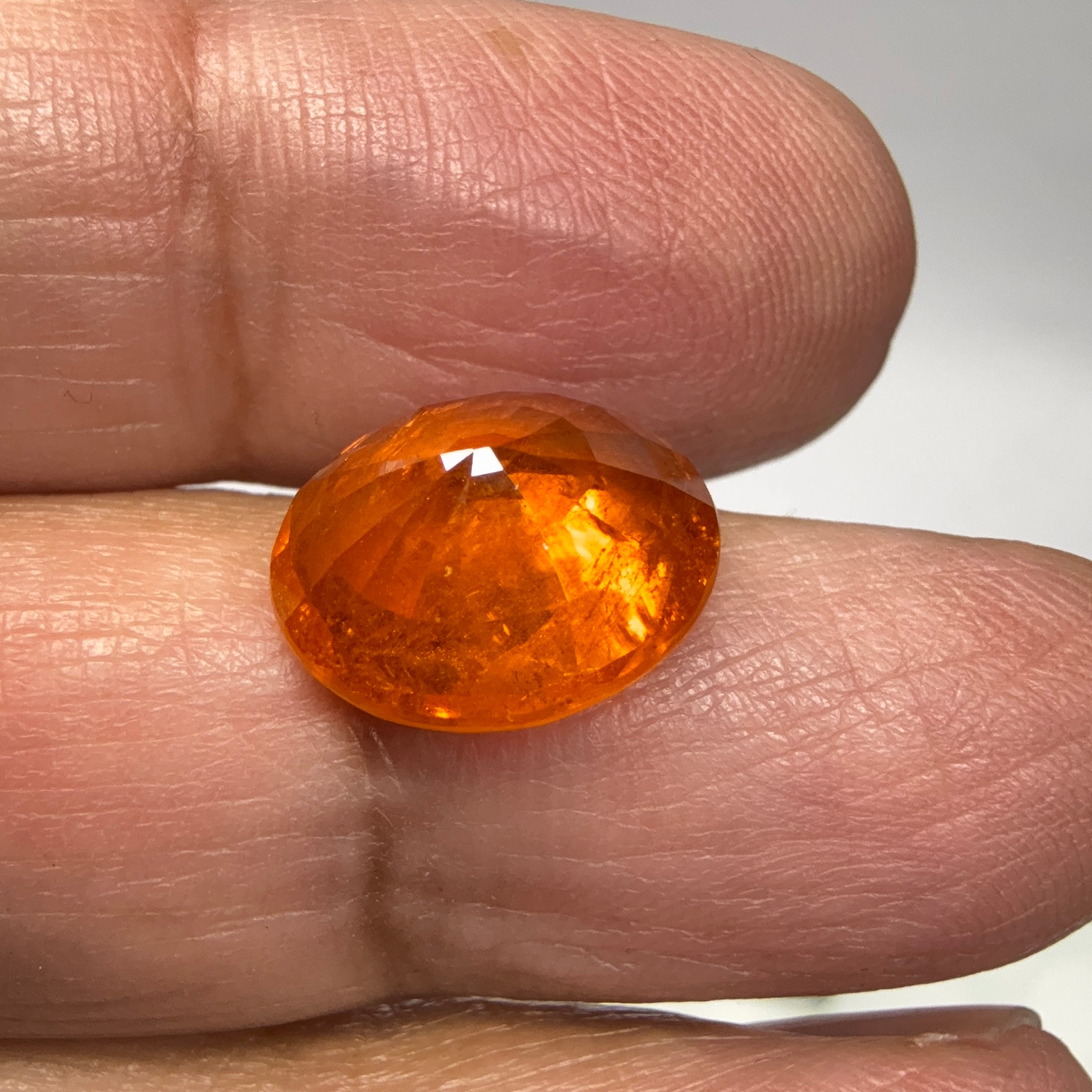 Mandarin Spessartite Garnet, 9.09ct, Untreated Unheated. 12.8 x 11.2 x 6.8mm, stone has some veils, slight sugar and inclusions