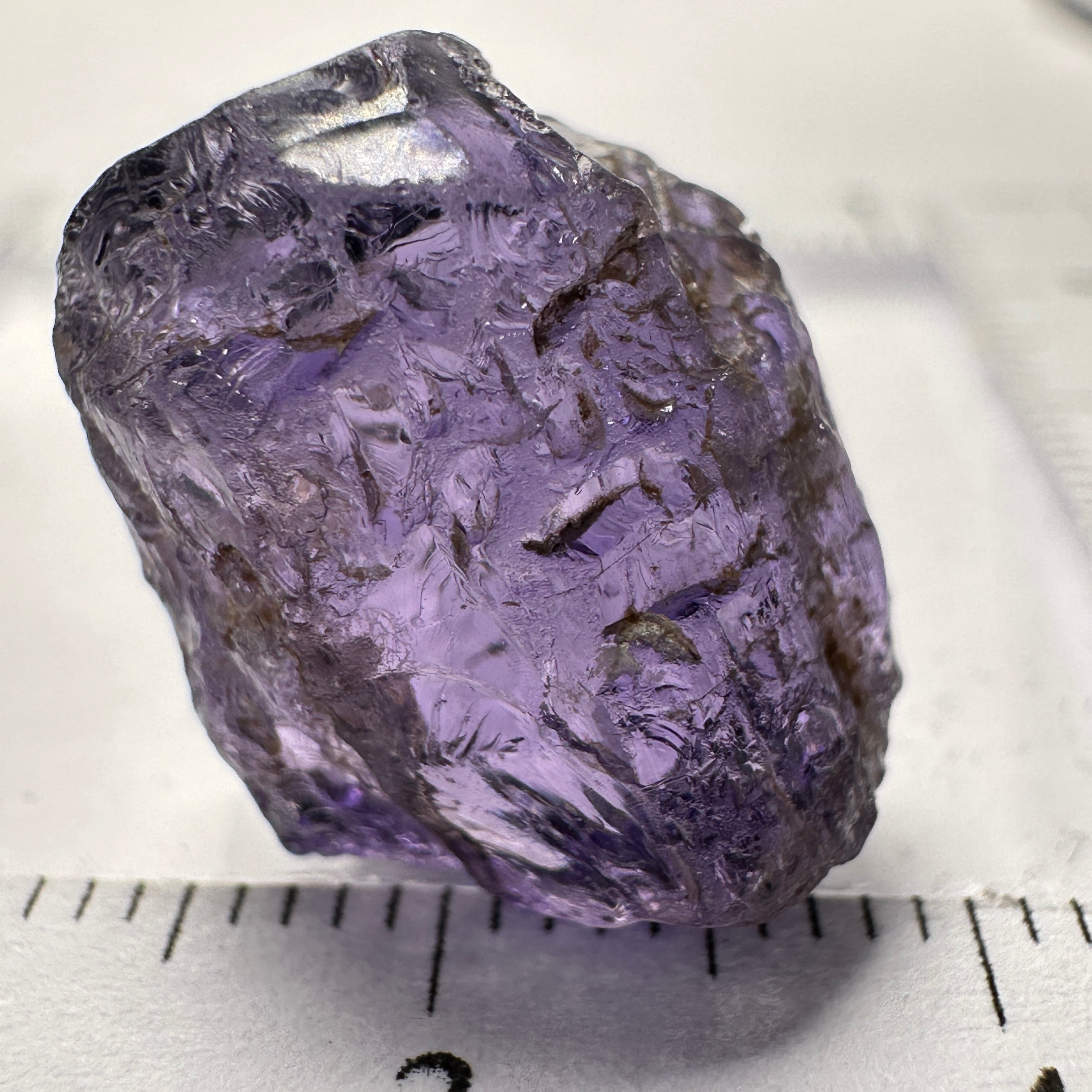 Purple Scapolite Crystal, 16.60ct, Tanzania, Untreated Unheated.VVS-IF clean with a single tiny spot 3mm into the stone, you can cut with it, will not be seen with the naked eye once cut, there is a crack on the outside which will come off in pre-forming