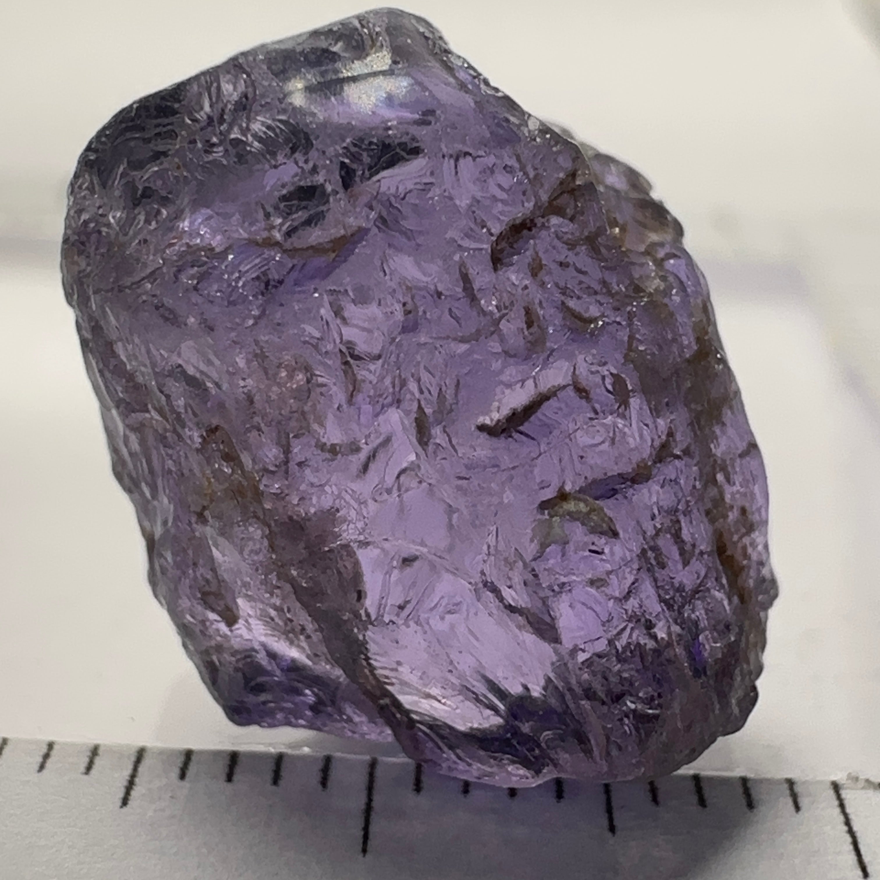 Purple Scapolite Crystal, 16.60ct, Tanzania, Untreated Unheated.VVS-IF clean with a single tiny spot 3mm into the stone, you can cut with it, will not be seen with the naked eye once cut, there is a crack on the outside which will come off in pre-forming