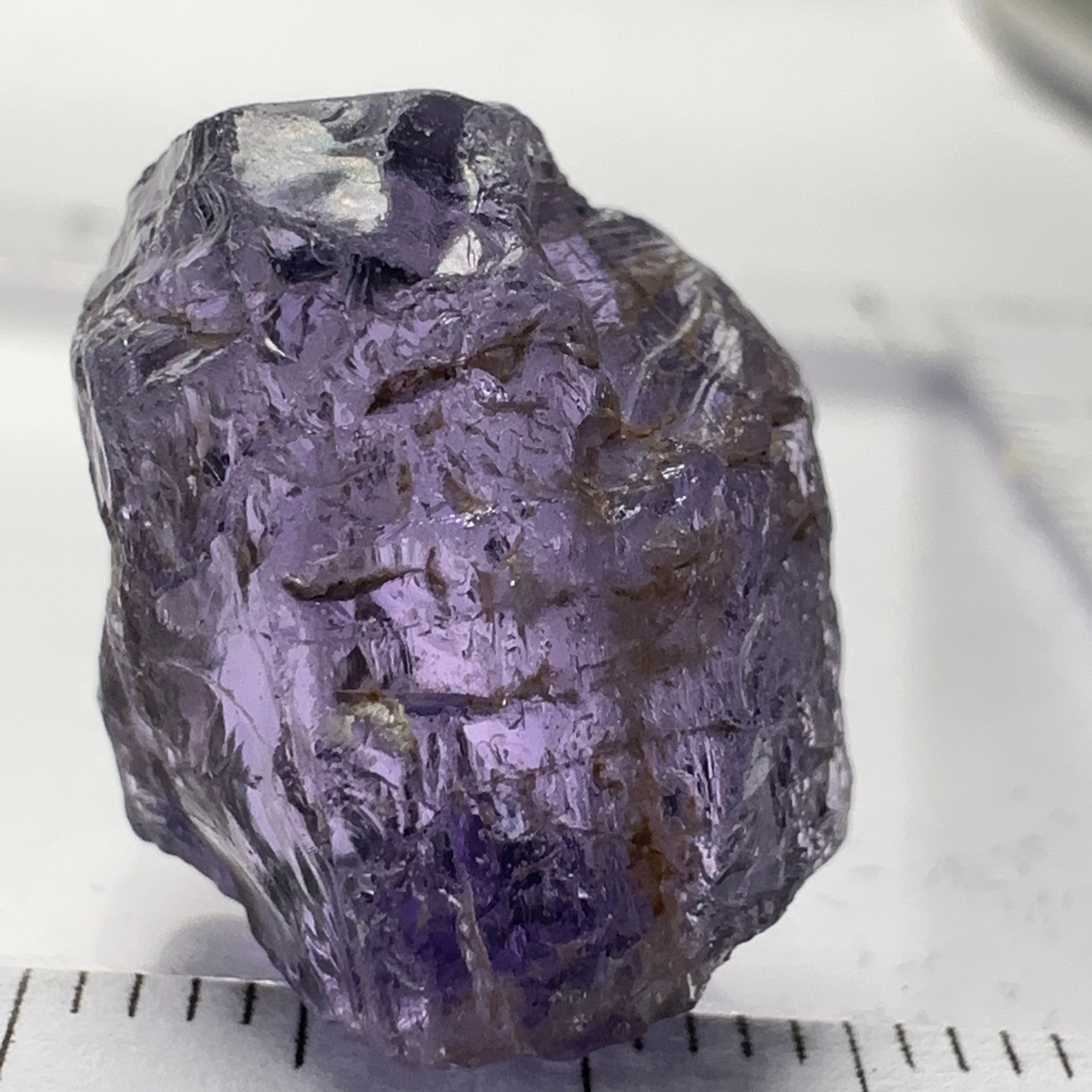 Purple Scapolite Crystal, 16.60ct, Tanzania, Untreated Unheated.VVS-IF clean with a single tiny spot 3mm into the stone, you can cut with it, will not be seen with the naked eye once cut, there is a crack on the outside which will come off in pre-forming