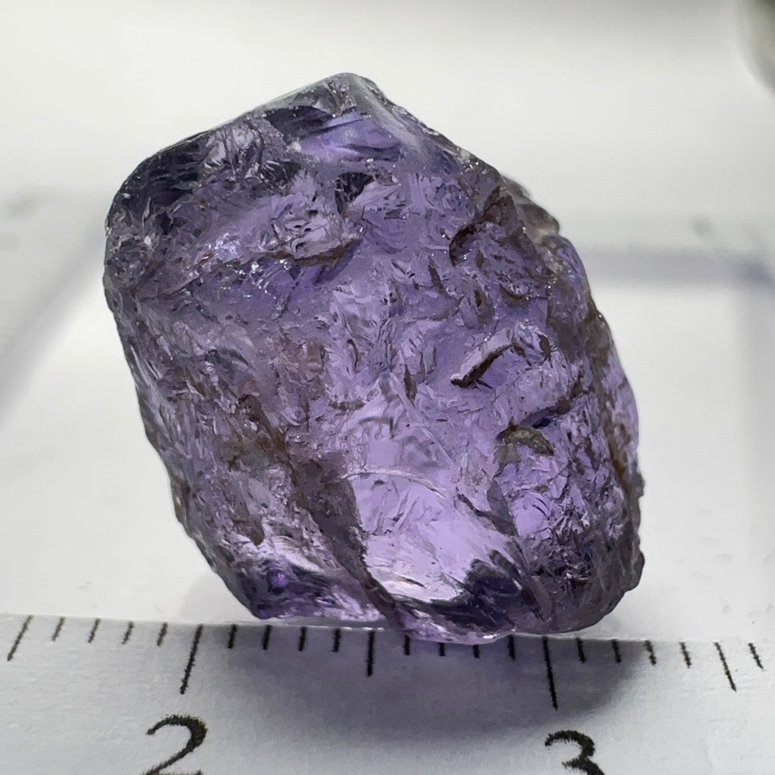 Purple Scapolite Crystal, 16.60ct, Tanzania, Untreated Unheated.VVS-IF clean with a single tiny spot 3mm into the stone, you can cut with it, will not be seen with the naked eye once cut, there is a crack on the outside which will come off in pre-forming