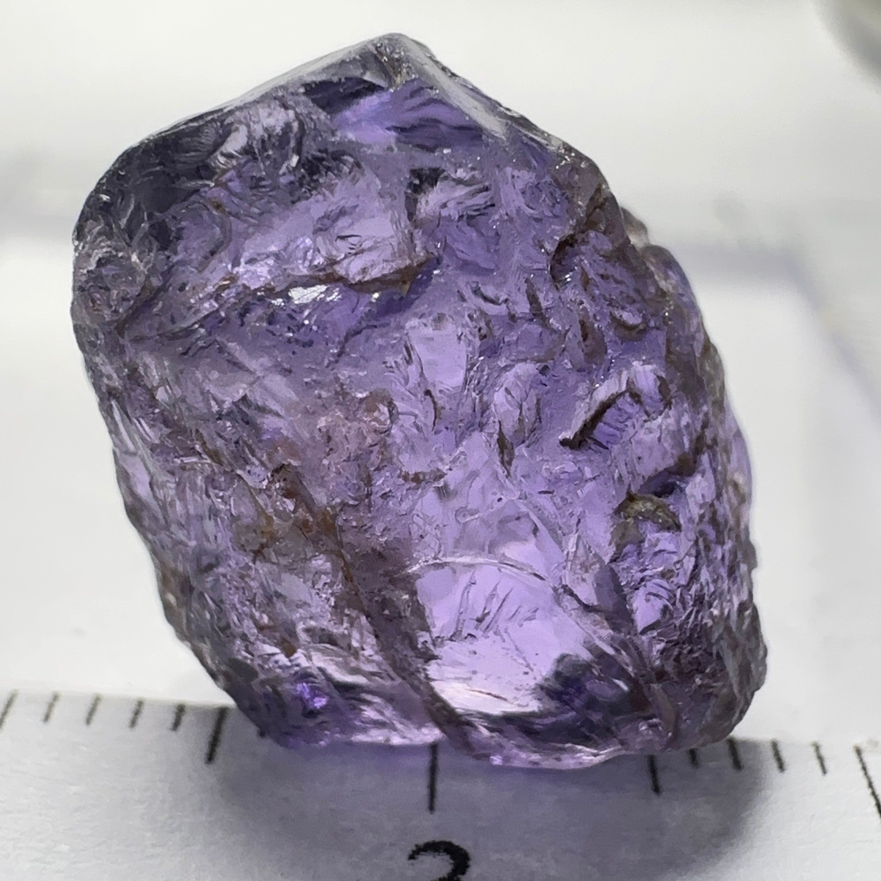 Purple Scapolite Crystal, 16.60ct, Tanzania, Untreated Unheated.VVS-IF clean with a single tiny spot 3mm into the stone, you can cut with it, will not be seen with the naked eye once cut, there is a crack on the outside which will come off in pre-forming