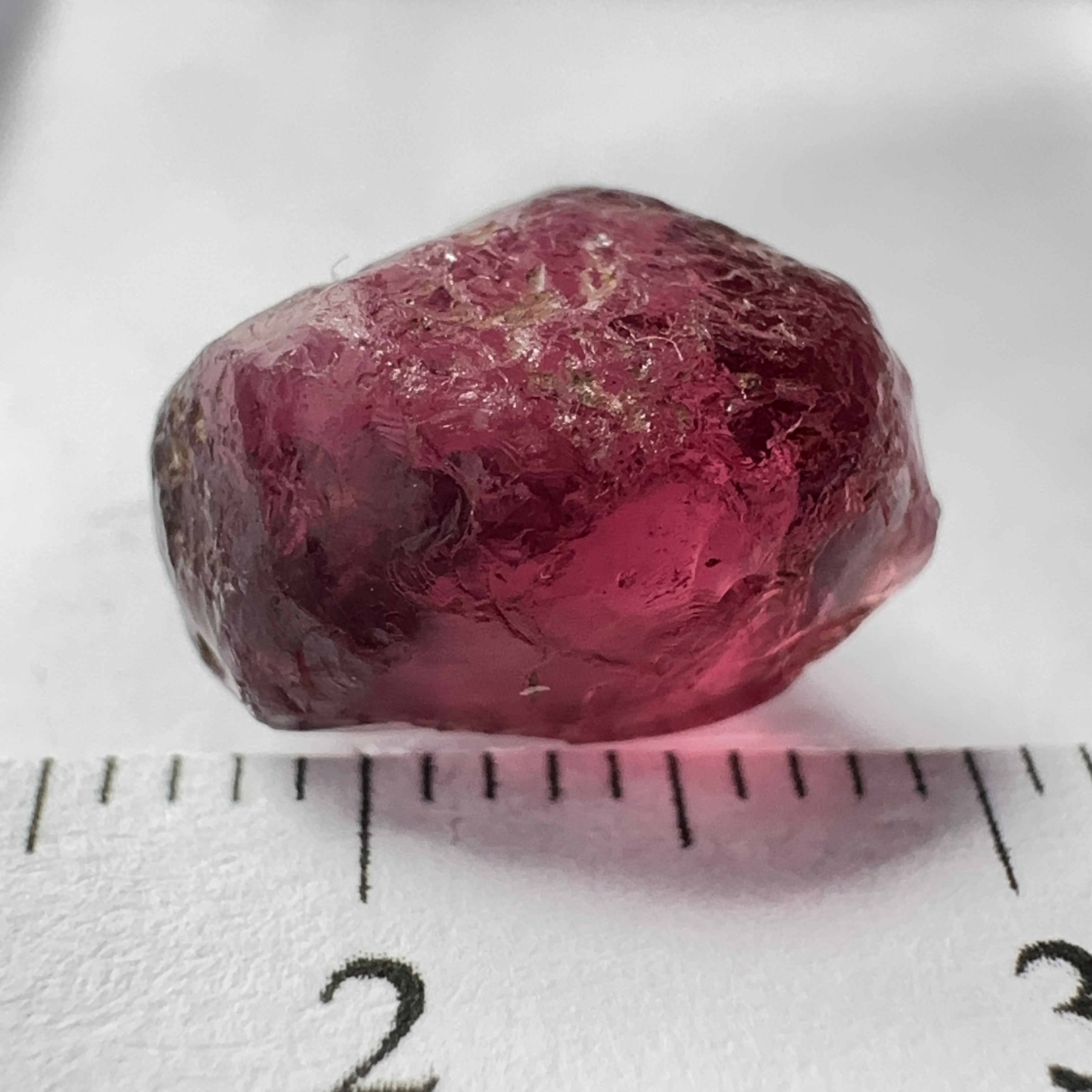 Rhodolite Garnet Colour Shifting, 8.46ct, Umba, Tanzania, Untreated Untreated. Slight skin issue (2mm on one side) will come off on faceting, rest vvs-if