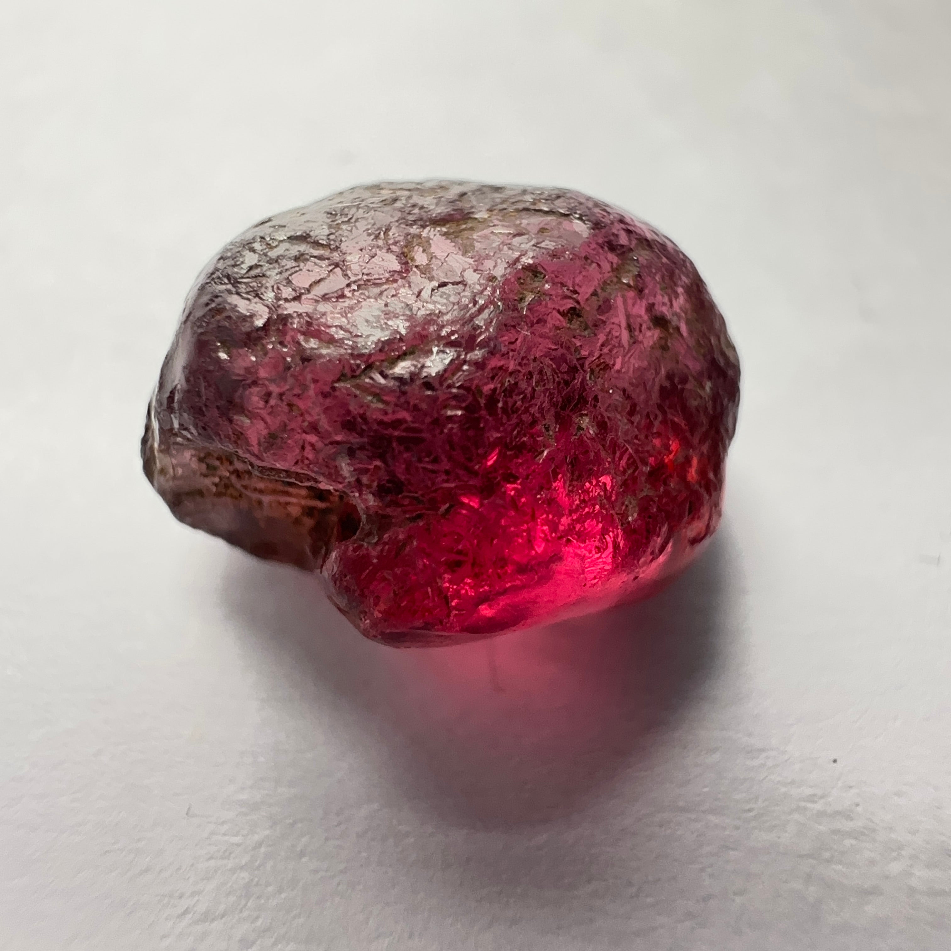 Rhodolite Garnet Colour Shifting, 8.46ct, Umba, Tanzania, Untreated Untreated. Slight skin issue (2mm on one side) will come off on faceting, rest vvs-if